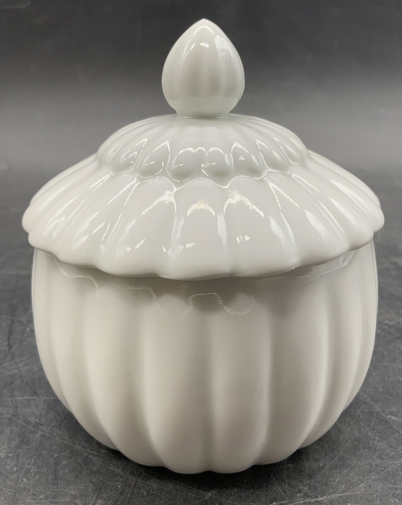 Limoges White Porcelain Lidded Jar FRANCE: Lidded jar features a round body & matching lid, both adorned w a ribbed pattern. Lid has a small pointed finial. Signed & marked on underside. Reads, LIMOGES FRANCE. Surface wear consistent to age, u