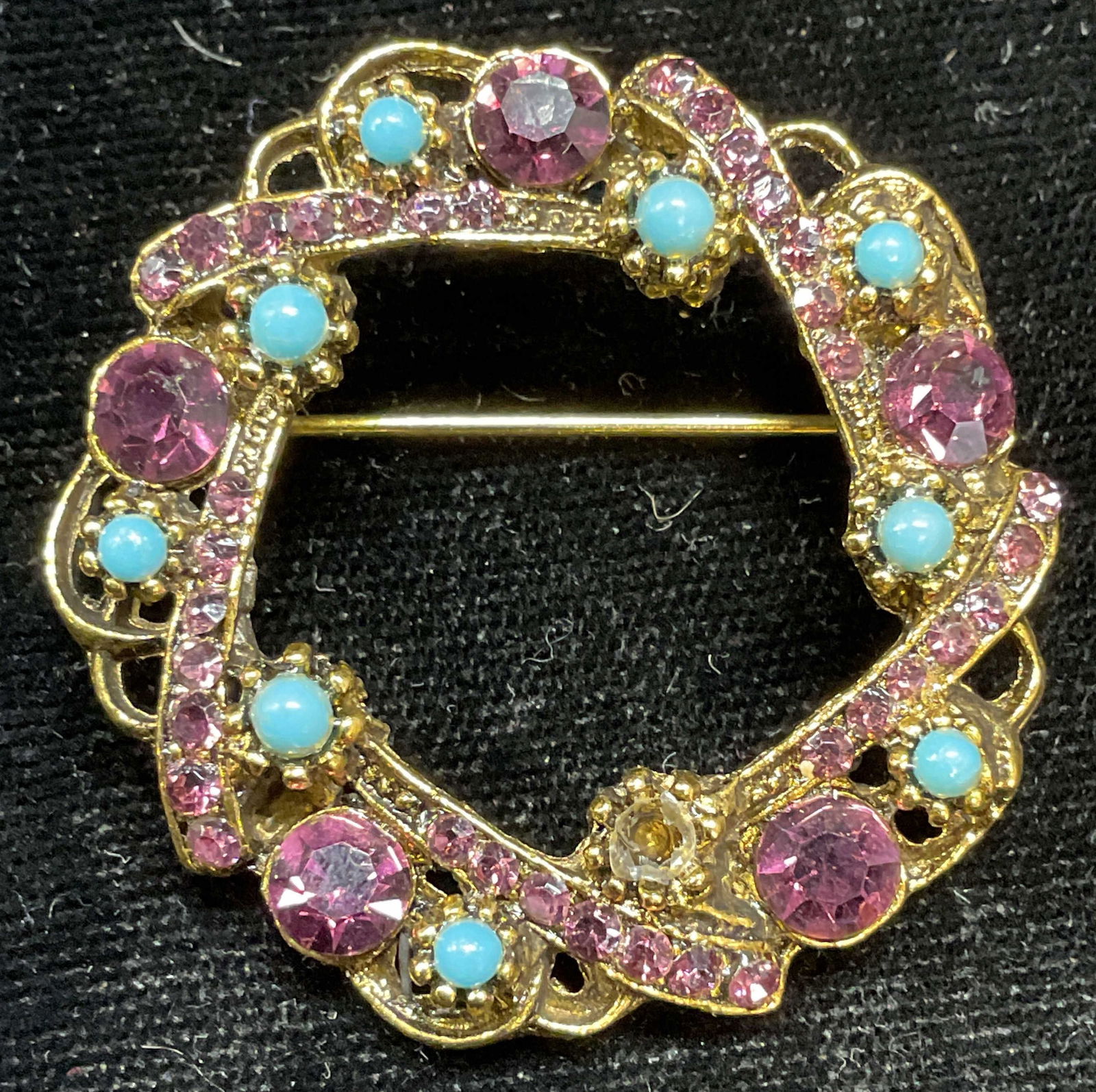 Gold Tone Purple Crystal Open Circle Brooch: Gold tone purple crystal and faux turquoise open circle brooch. Measures approx 1.5 inches. Some scratching. One cabochon needs replacement. Jewelry, estate jewelry, costume jewelry, cocktail jewelry,