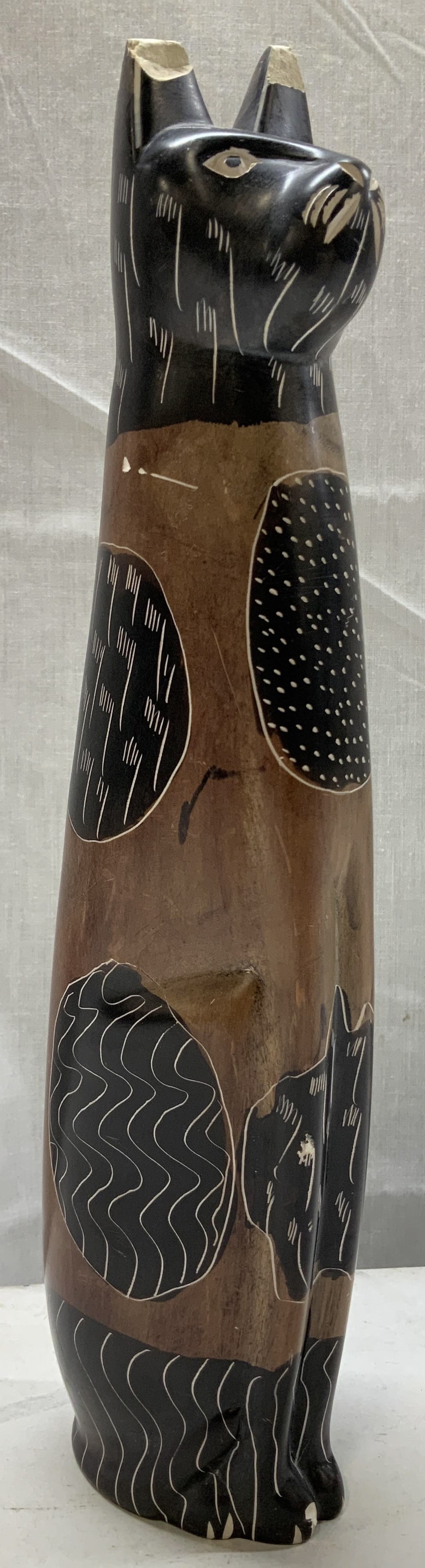 Hand Painted Stone Cat Figurine KENYA: Cat figurine is stone & features hand-painted swirling accents. Shades of brown, black & white. Piece has weight. Signed & marked on underside. Reads, A GENUINE INTERPORT. PRODUCT HAND MADE IN KENYA.