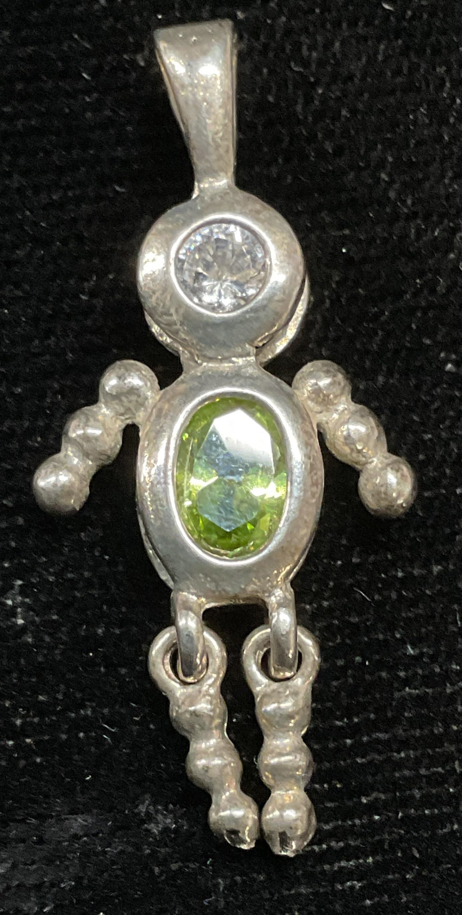 Vintage Sterling Silver Crystal Figural Pendant: Vintage sterling silver figural pendant with green and colorless crystals. Marked sterling. Measures approx 1 x .5 inches. Total weight 2.5 grams. Some scratching. Jewelry, estate jewelry, fine jewelr