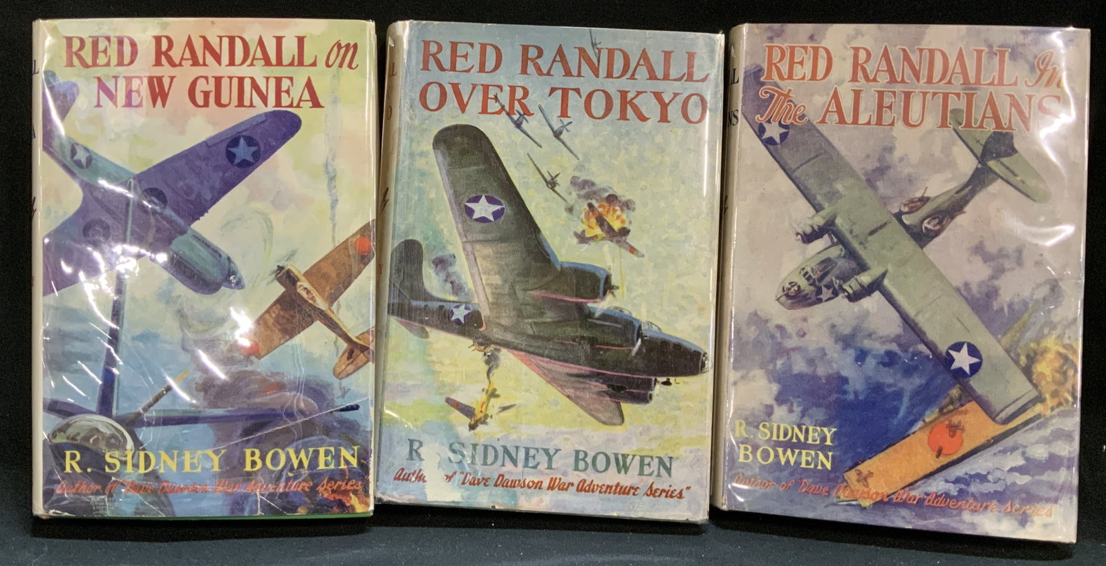 3 War Adventure Series Bks 1944-45 R Sidney BOWEN: Lot includes, Red Randall on New Guinea by R. Sidney Bowen (1944), Red Randall Over Tokyo by R. Sidney Bowen (1944) & Red Randall in the Aleutians by R. Sidney Bowen (1945). Grosset & Dunlap. Books fe