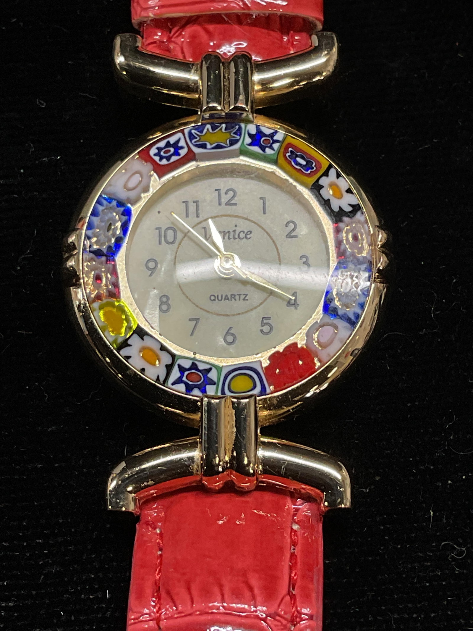 Venice MURANO Art Glass Wristwatch: Signed Venice MURANO Art glass millefiori case wristwatch. Faux reptile leather red strap. Cade measures approx 1 inch wide. Not tested. Some scratching. Jewelry, estate jewelry, costume jewelry, cock