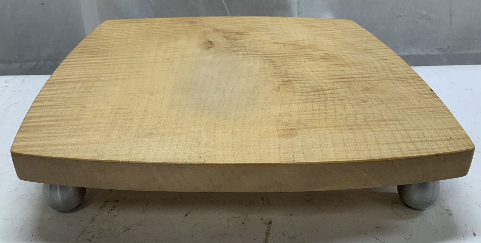 Wooden Square Cheese Board W Silver Toned Feet: Cheese board is wooden & features a square design w rounded edges. 4 silver toned metal feet. No visible signature or markings. Measurements: length 14.8in x width 13.7in x height 3in. Wooden square c