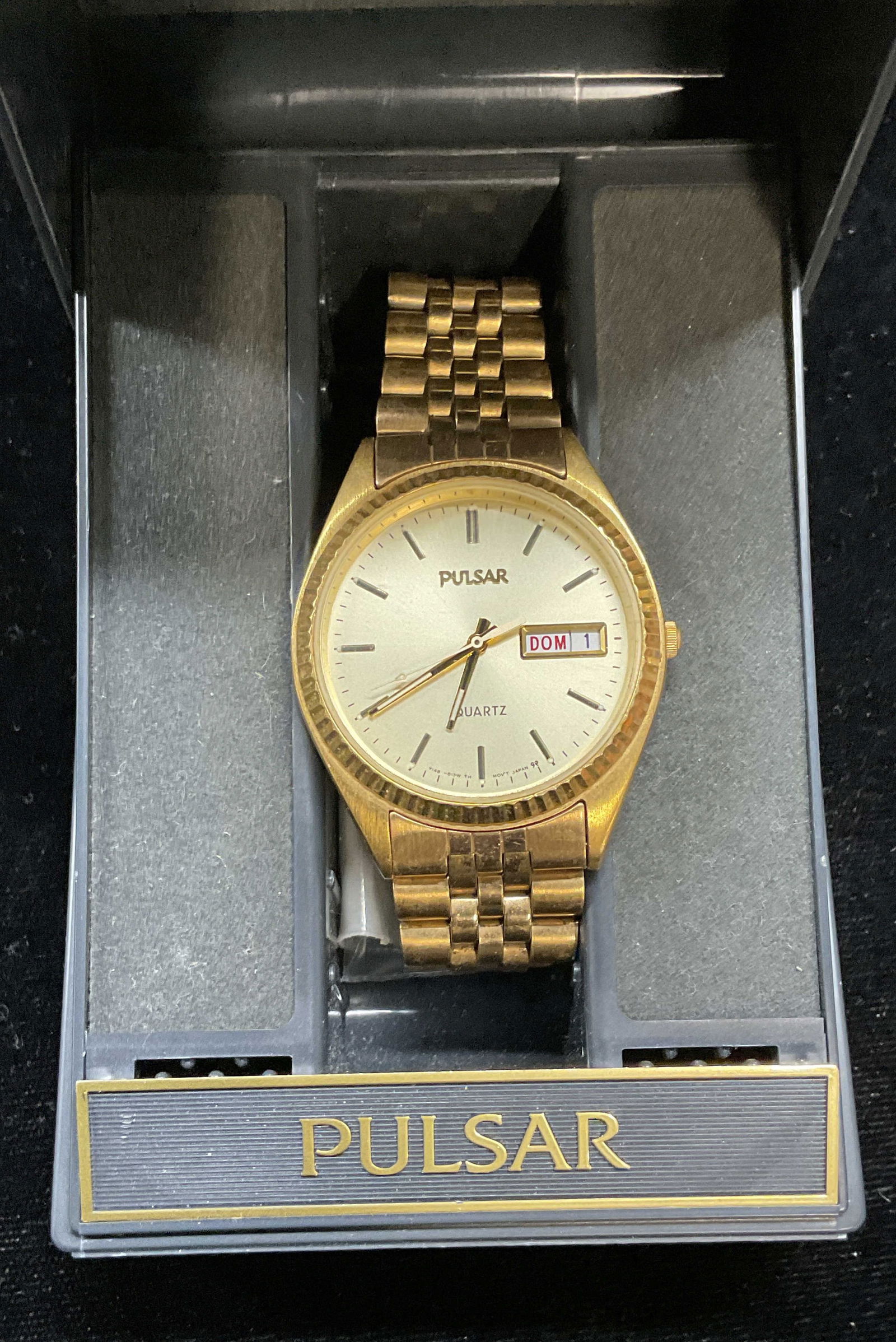 Pulsar Gold Tone Wristwatch with Box: Signed Pulsar gold tone wristwatch. Includes watch box and extra links. Watch face measures approx 1.25 inches wide. Not tested. Some scratching. Jewelry, estate jewelry, costume jewelry, cocktail jew