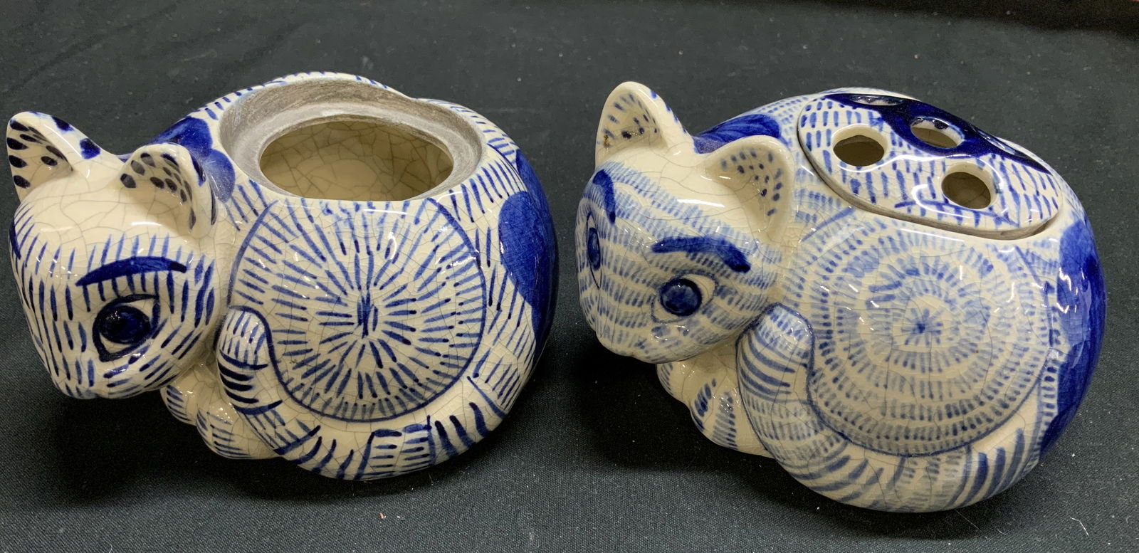 Pair Nancy Lopez 1978 Ceramic Cat Incense Burners: Lot includes, 2 incense burners / flower frogs shaped like a ceramic cat. Blue & white tones w line accents. Top of cat features a removable lid. One appears to be missing, lot is sold as is. Signed &