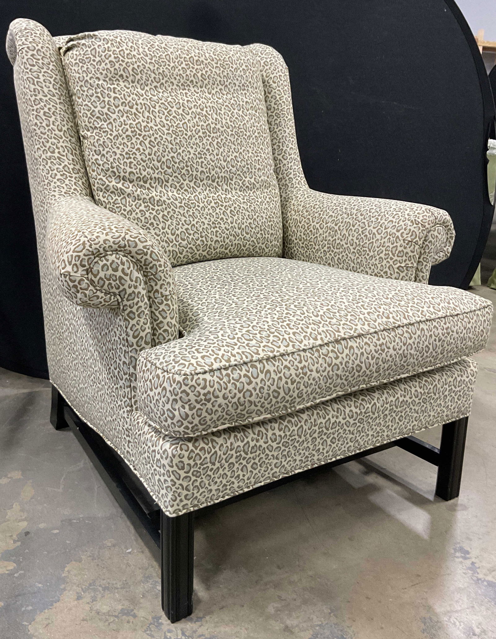 Jessica Charles Furniture Leopard Wing Chair USA: Jessica Charles Furniture leopard wing chair. Made in North Carolina. Lining is polyester. Cushions are urethane and polyester. Upholstered cushions in a beige, brown, and grey leopard pattern. Loose
