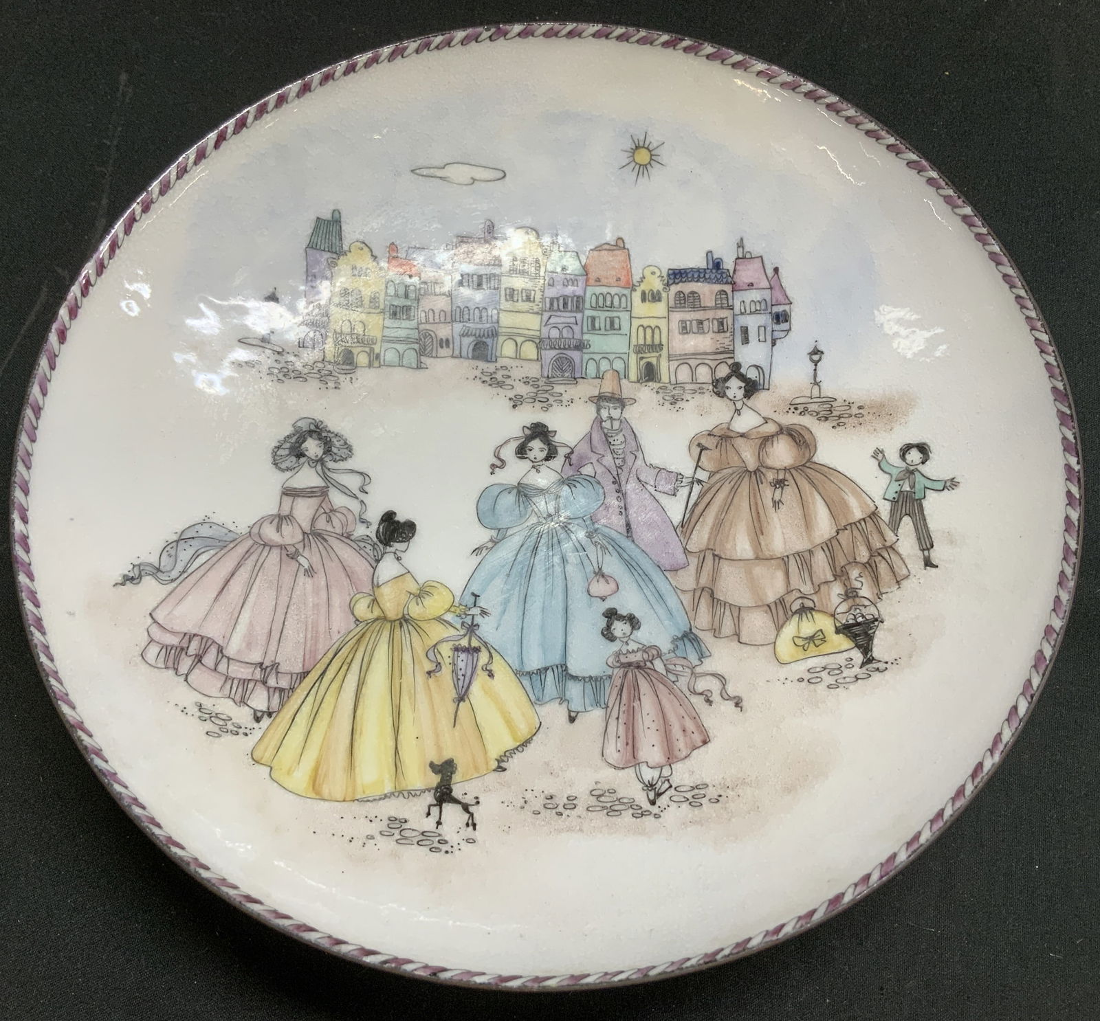 Vtg Steinbock Hand Painted Enamel Bwl AUSTRALIA: Vintage enamel bowl featuring a hand-painted illustrations of figures in Victorian style dresses strolling in a town square. Shades of yellow, blue, purple, brown & black. Signed & marked on underside