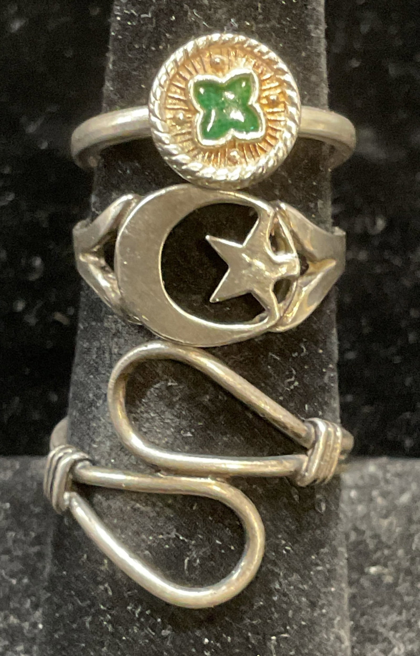 Lot 3 Vintage Sterling Silver Rings: Lot of 3 Vintage sterling silver rings. Star and moon, enamel, and open bands. Largest ring size 7. Total weight of all rings 5.7 grams. One band needs repair. Some scratching and warping. Jewelry, es