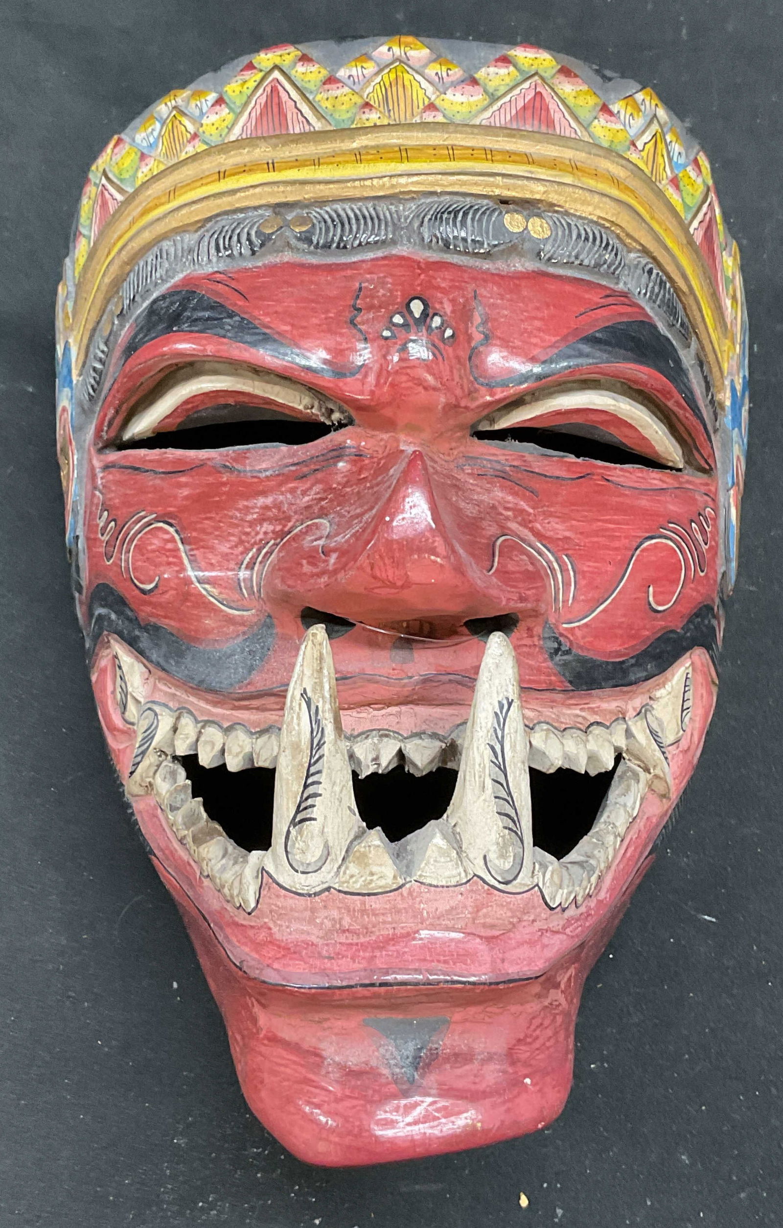 Asian Hand Painted Wood Cakil Mask: Asian carved wood Cakil mask. Hand painted with ornate decorative detail. Measures approx 8 x 6 x 6.5 inches. Some wear consistent with exposure. Asian mask, cakil mask, figural mask, demon mask, coll