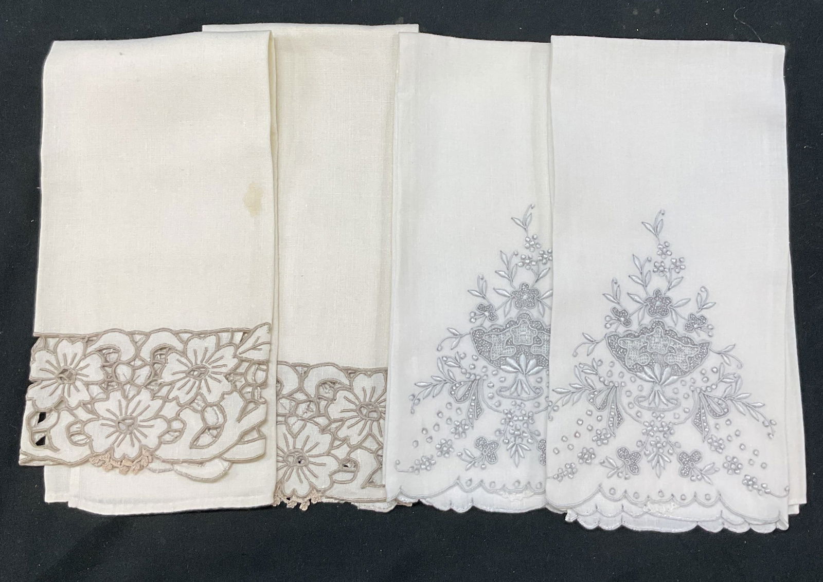 Lot 4 Vintage White Linen Embroidered Tea Towels: Lot of 2 vintage white linen embroidered tea towels. Scalloped trim. Features embroidered floral motifs and ornate scroll designs in a grey finish. Largest piece measures approx 13 1/2 x 19 1/2 inches