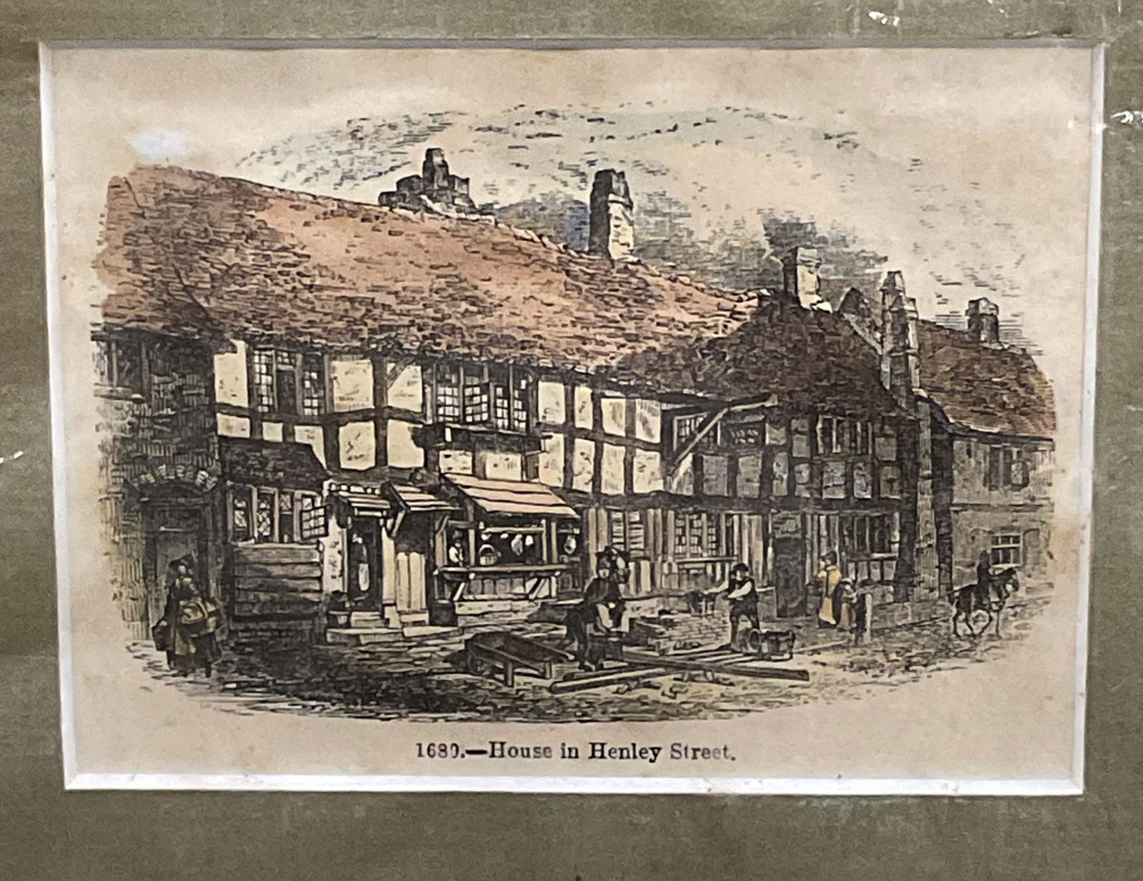 Antique House, Henley Street Color Engraving: Matted antique hand colored engraving on paper. House on Henley Street. English scenery. Published c. 1880. Not examined out of mat. Mat measures approx 7.75 x 8.75 inches. Some foxing. Label from Pic