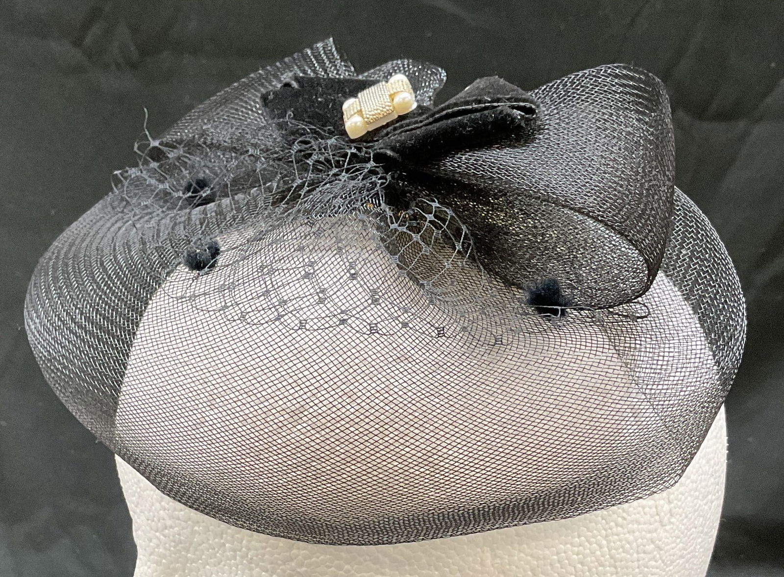 Vintage Black Mesh Accented Fascinator: Vintage black mesh accented fascinator. Feels like mesh. Accented with mesh bow and gold toned bead. Measures approx 8 1/2 inches wide. Wear consistent with exposure. Fascinator, hat, vintage fascinat