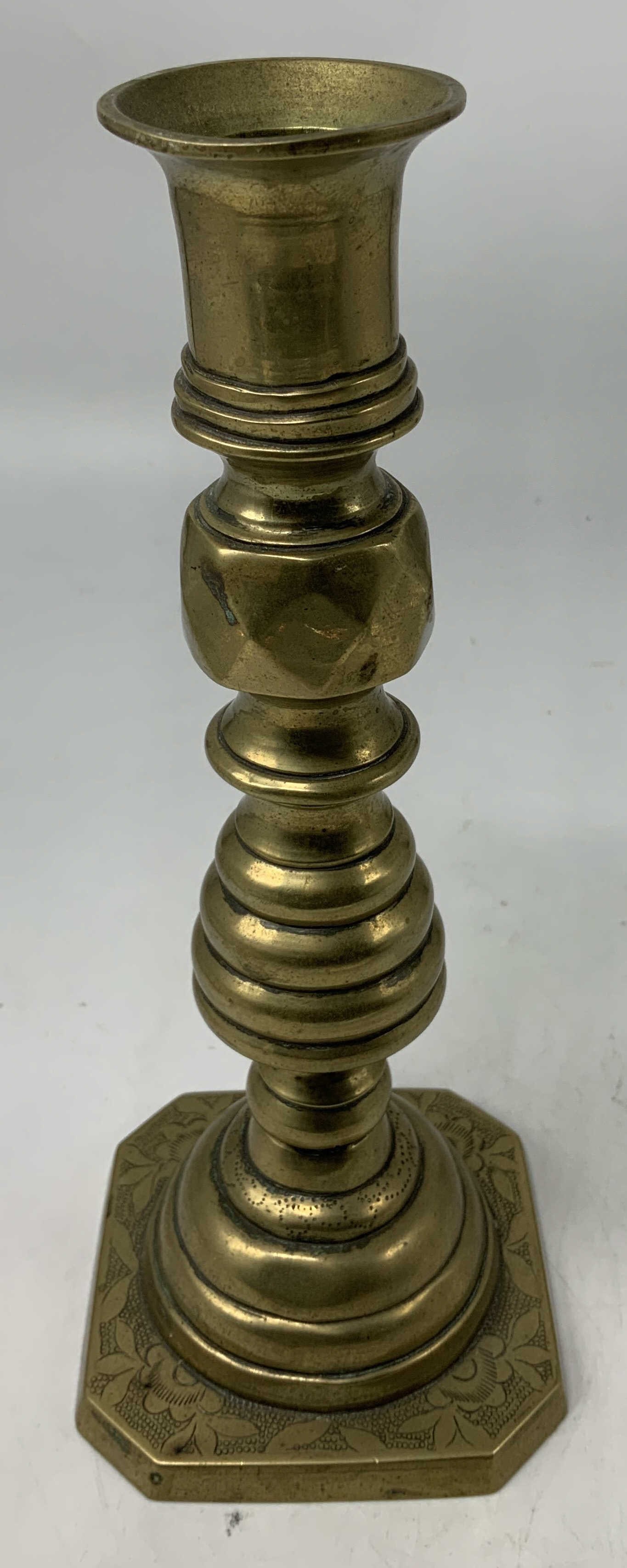 Vtg Brass Beehive Push Up Candlestick: Candlestick is brass & features a flared candle cup over a turned column with stacked accents. Base has engraved floral detailing. Push up mechanism. Beehive style. Surface wear consistent to age, use