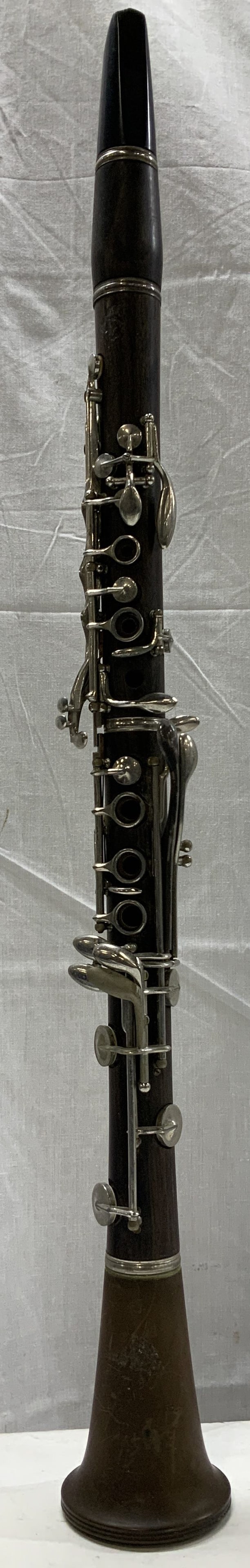 Vtg Boosey & Hawkes Wooden Clarinet ENGLAND 26in: Vintage Boosey & hawkes clarinet is made of dark wood w silver toned keyword. Tapered lower joint & mouthpiece on top. Signed & marked. Reads, 77 MADE BY BOOSEY & HAWKES. LONDON. MADE IN ENGLAND. Surf