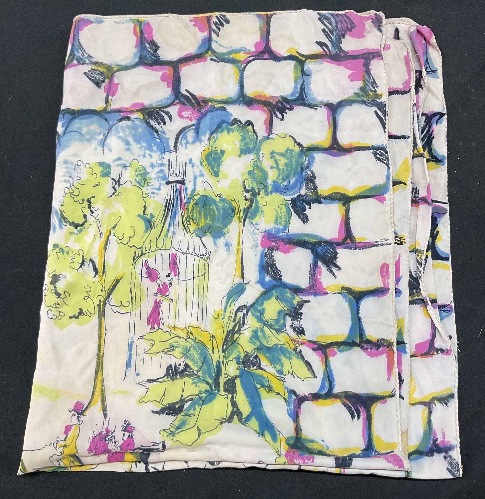 Vintage Park Scene Silk Scarf: Vintage park scene silk scarf. Silk material. Depicts a nature park scene with human and animal figures, floral, and water motifs. Brick style border. Colors include blue, green, pink, yellow, black, 