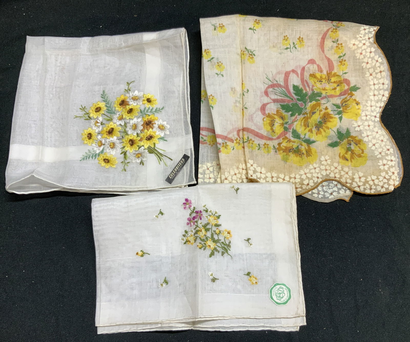 Lot 3 Vntg Yellow Floral Handkerchiefs SWITZERLAND: Handkerchiefs are cotton & possible linen material. Handkerchiefs feature yellow & white flowers with green leaves. Signed & marked. Reads, CELEBRITIES MADE IN SWITZERLAND, DESCO MADE IN SWITZERLAND.