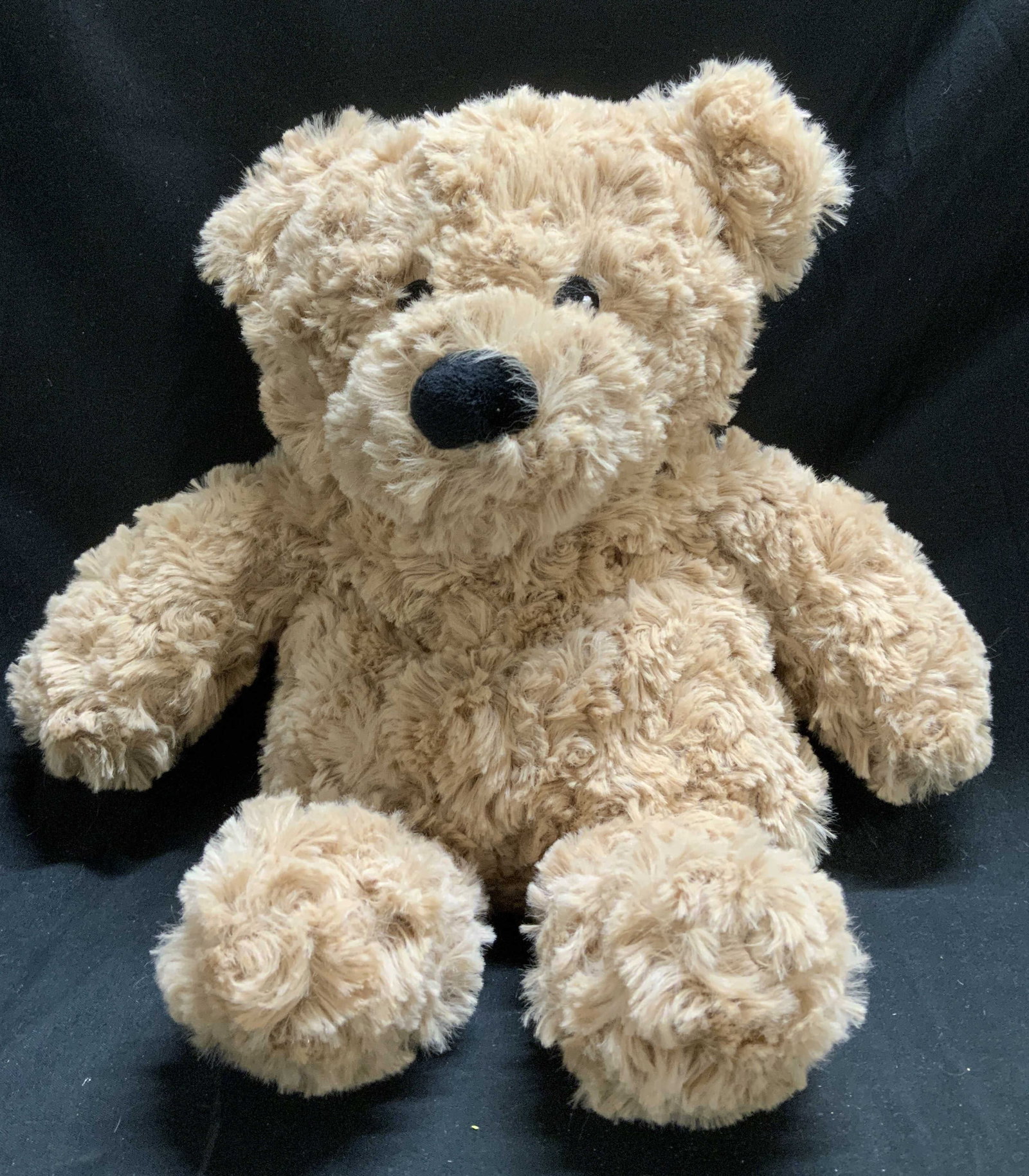 Warmies Brown Curly Bear Junior Plush: Brown Curly Bear Junior Warmies plush. Depicts a bear w black eyes & nose. Plush has weight. Signed & marked. Reads, WARMIES. Surface wear consistent to age, use & exposure. Measurements: height 14in 