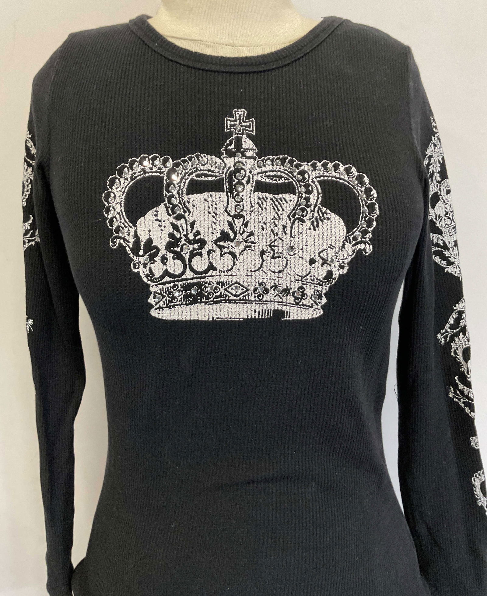 T Party Black Studded Crown Long Sleeve USA: T Party black studded crown graphic waffle knit long sleeve shirt. Size S. Cotton material. Made in USA Crown graphic on front, back, and sleeves. Illegible wording. Silver toned gems accented on fron