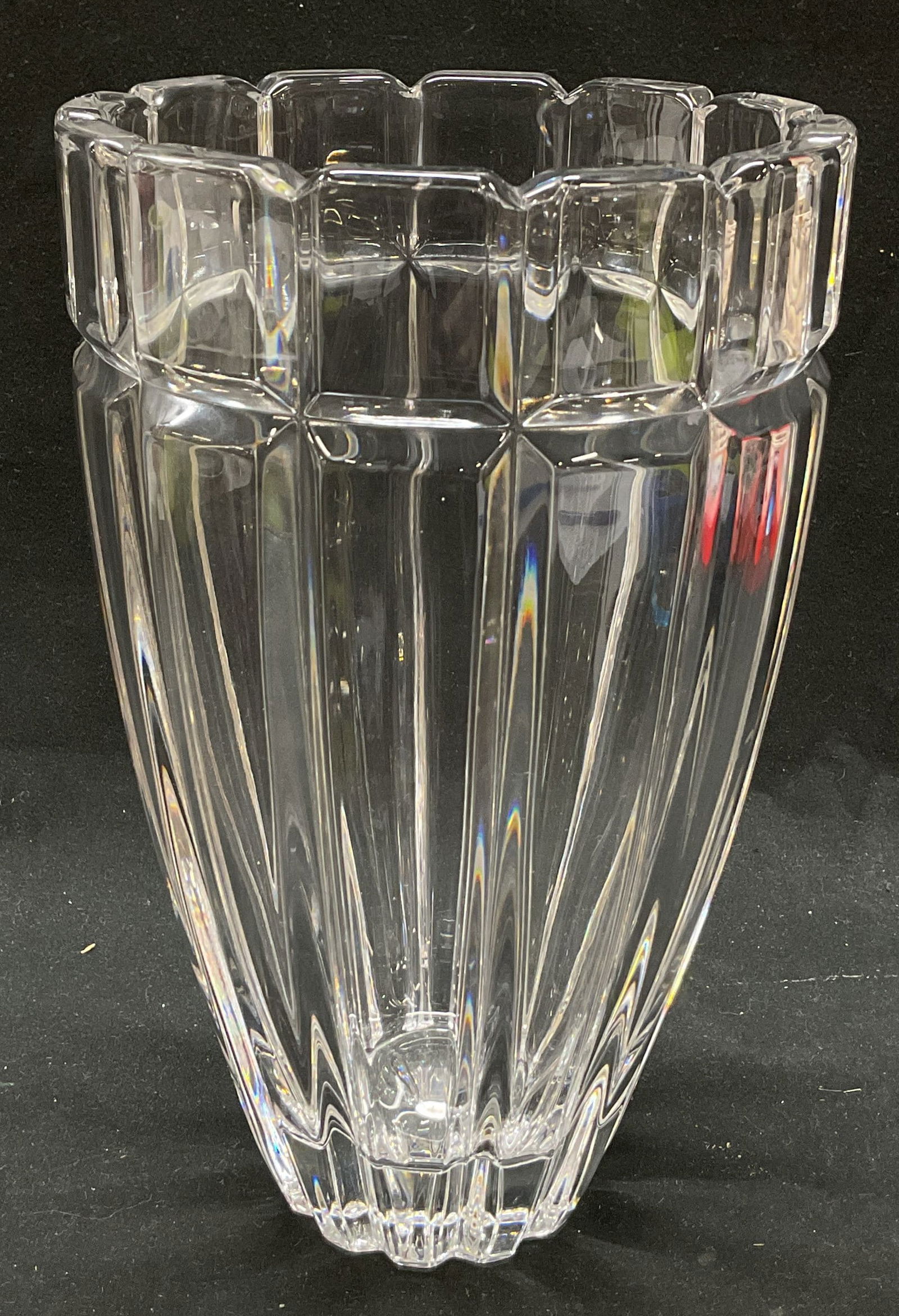 Vintage Crystal Faceted Vase: Vintage crystal faceted vase. Vertical cuts and grooves. Flared shape with fluted rim and solid base. Faceted body. Measures ht approx 8 1/2 inches diam approx 5 inches. Some scratching observed and s