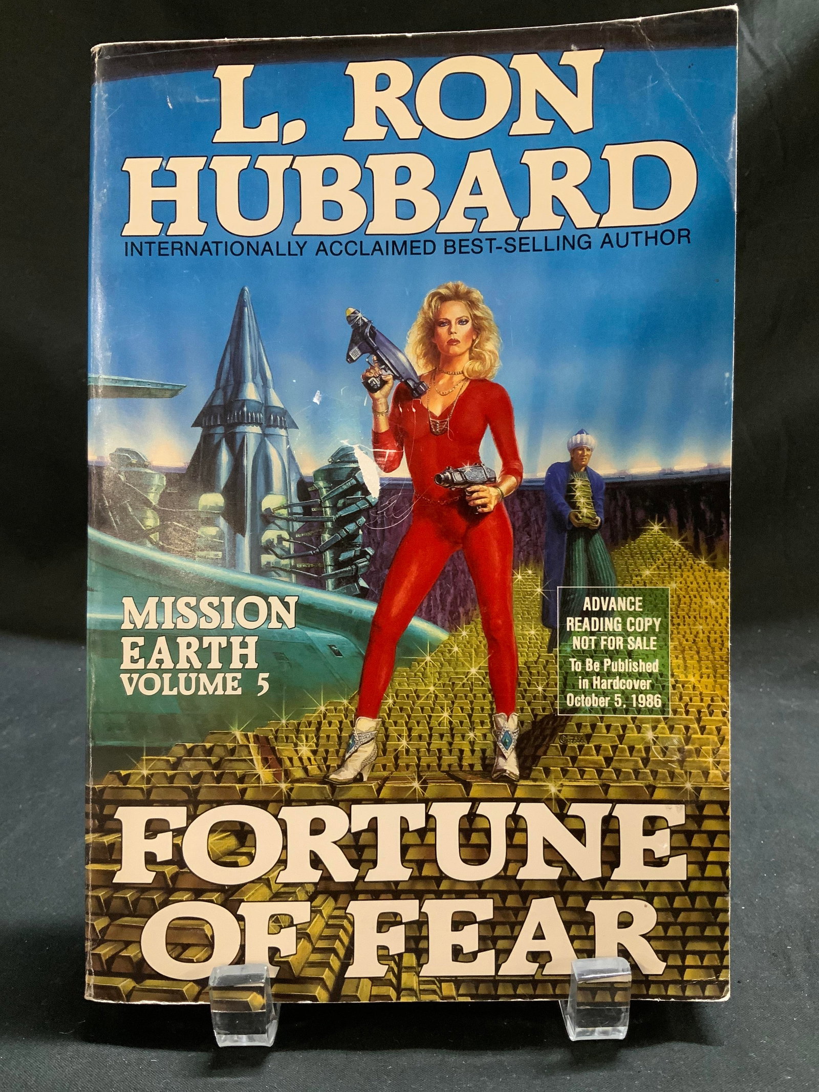 1986 Fortune of Fear Science Fict Bk L Ron HUBBARD: Fortune of Fear by L. Ron Hubbard. Mission Earth. The Biggest Science Fiction Dekalogy Ever Written. Volume 5. Bridge Publications, Inc. Copyright 1986. Advance reading copy. Front cover features illu