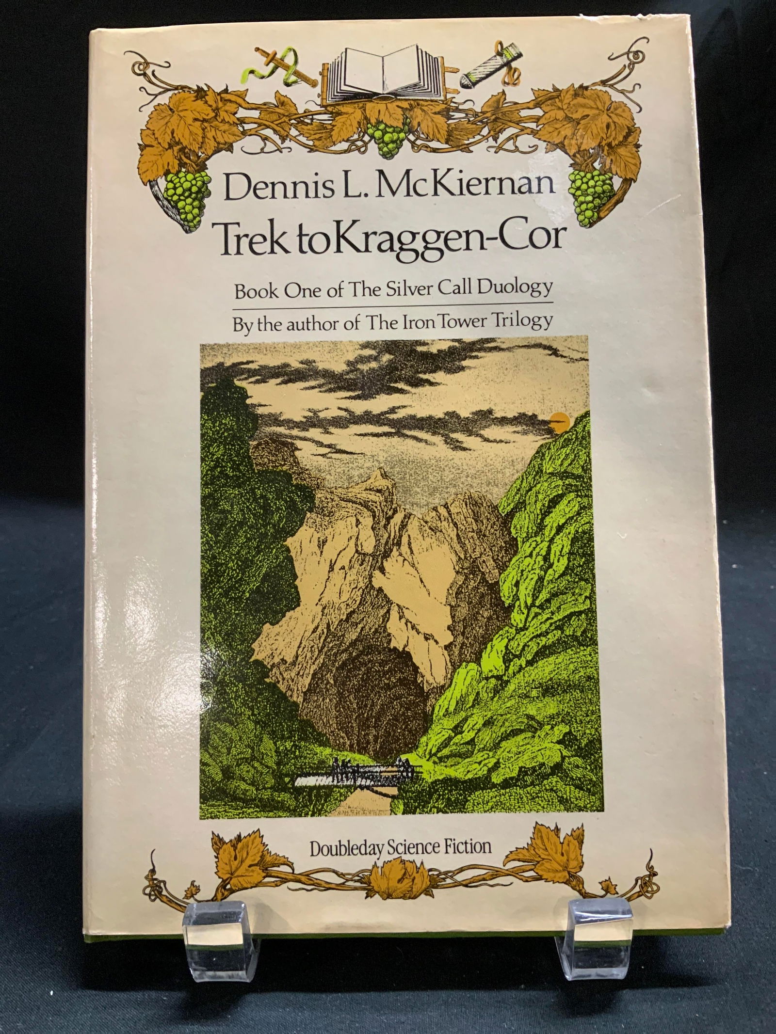 1986 Trek to Kraggen-Cor 1stEd Bk Dennis L Mckiernan: Trek to Kraggen-Cor. Book One of The Silver Call Duology. By Dennis L. McKiernan. Doubleday & Company, Inc. Garden City, New York. Copyright 1986, First Edition. Front cover features illustrations of