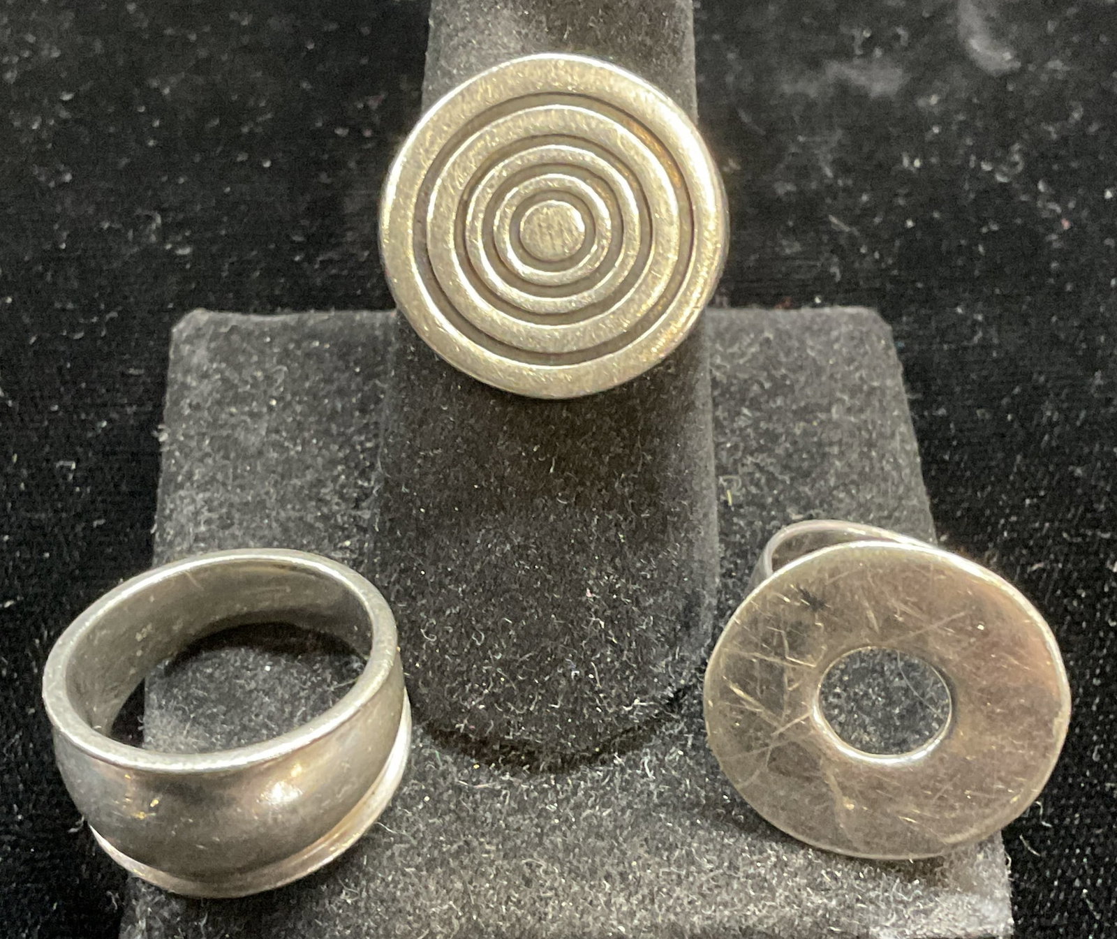 Lot 3 Vintage Sterling Silver Rings: Lot of 3 vintage sterling silver rings. Disc, circle, and solid band. Marked sterling. Largest ring size 7.5. Total weight of rings 22.2 grams. Jewelry, estate jewelry, fine jewelry, cocktail jewelry,