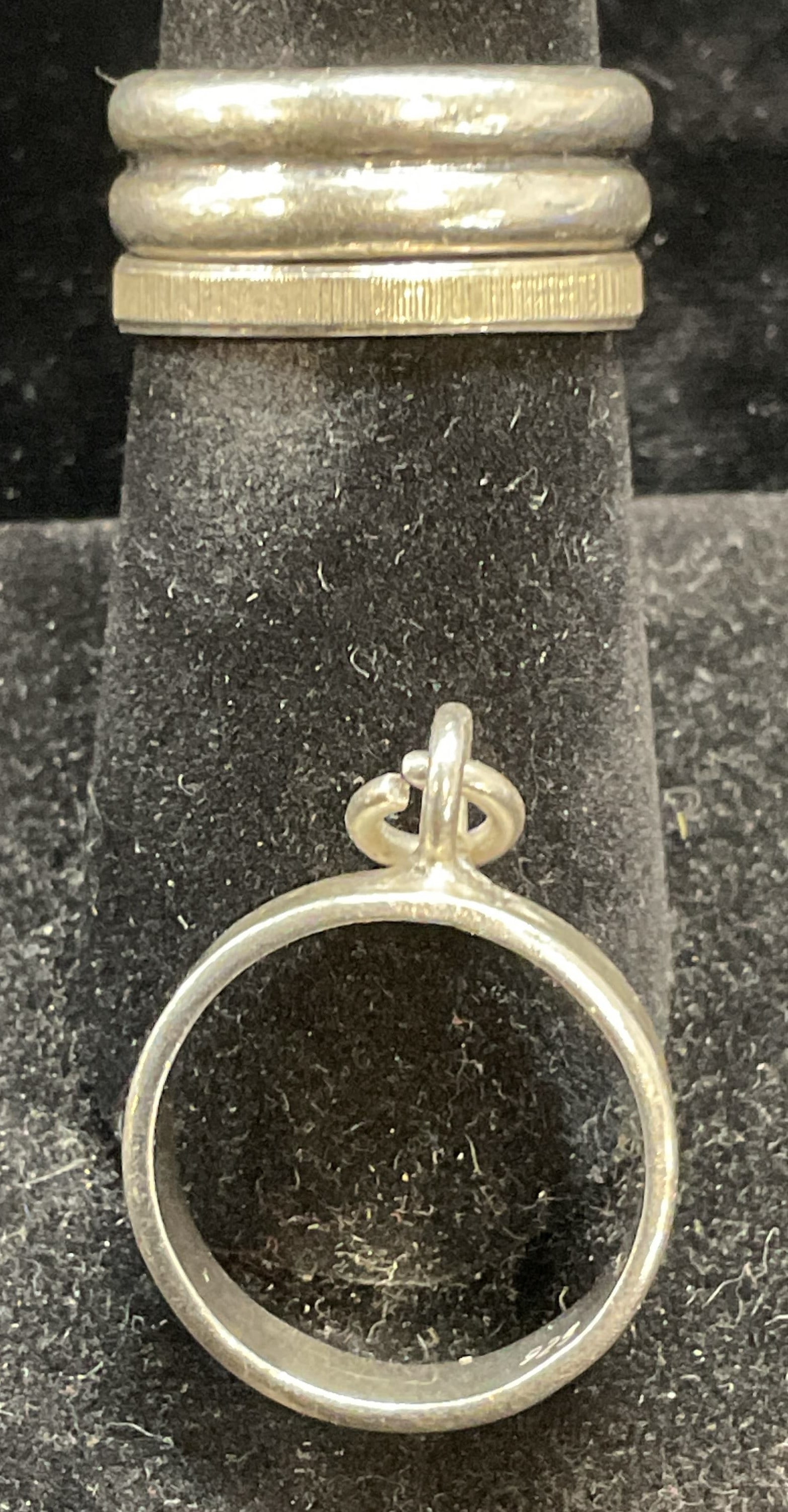 Lot 3 Sterling Silver Rings & Pendant: Lot of 3 sterling silver rings and open circle pendant. Marked sterling. Larger ring size 7. Pendant approx .75 inches wide. Total weight of all pieces 10.3 grams. Some scratching. Jewelry, estate jew