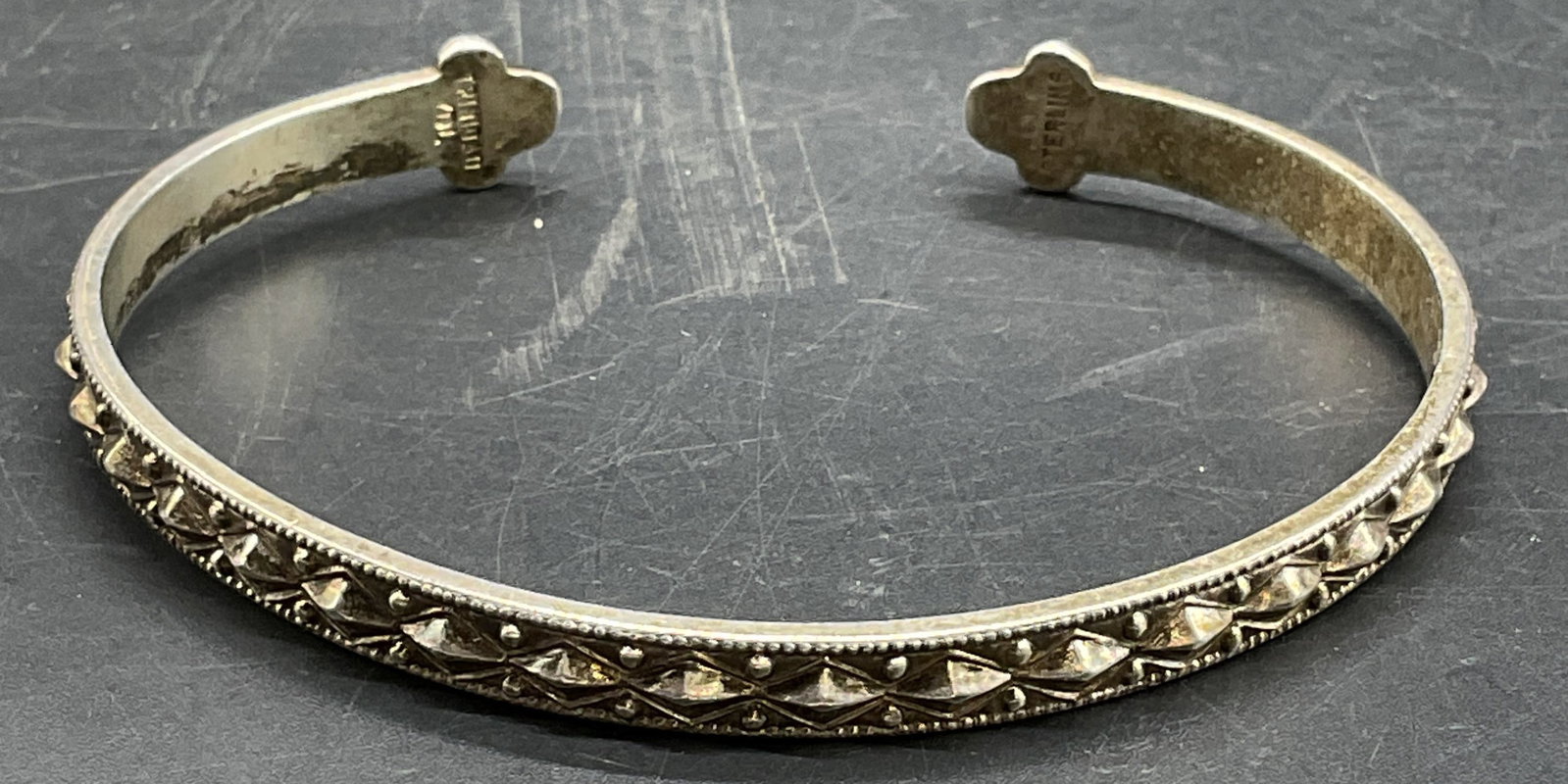 Signed YDL Sterling Silver Cuff Bracelet, Trinidad: Signed YDL sterling silver cuff bracelet with raised geometric band. Marked sterling, made in Trinidad. Measures approx 2.75 inches wide. Total weight 19.8 grams. Some scratching. Jewelry, estate jewe