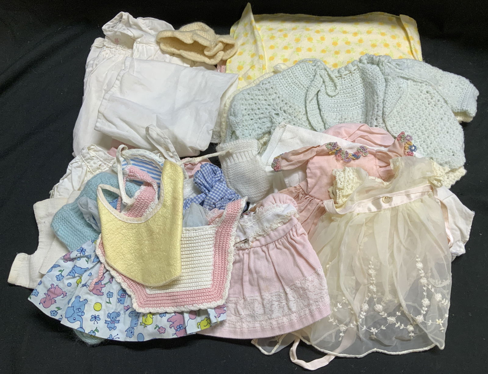 Lot 20+ Assorted Vtg Doll Clothing & Bedding: Lot 40+ assorted vintage doll clothing. Including socks, dresses, bibs, dresses, undergarments & bedding. Pieces are embroidered or have lace detailing. Lot is sold as is. Surface wear consistent to a