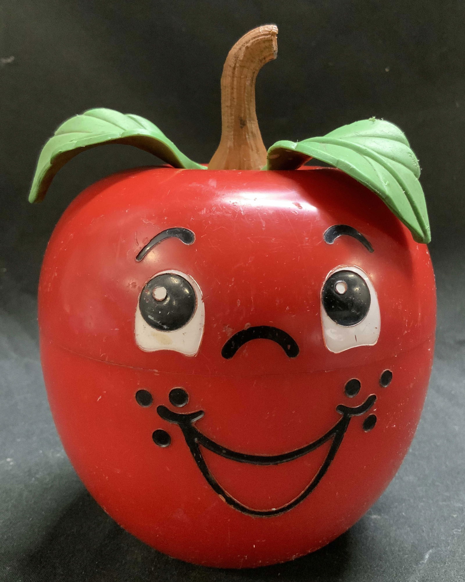 Vntg Fisher Price Happy Apple Chime Toy USA: Vntg Fisher Price Happy Apple Chime Toy Apple-shaped toy with a smiling face & leaves. Toy is weighted and returns to an upright position & contains chimes. Signed & marked. Reads FISHER PRICE HAPPY A
