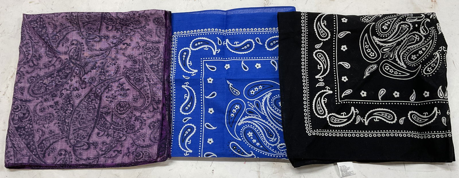 Lot 3 Paisley Cotton Handkerchiefs India: Lot of 3 paisley cotton handkerchiefs. Includes black and white paisley handkerchief, made in India, cotton material. Blue, white, and black paisley handkerchief, made in India, cotton material. Purpl