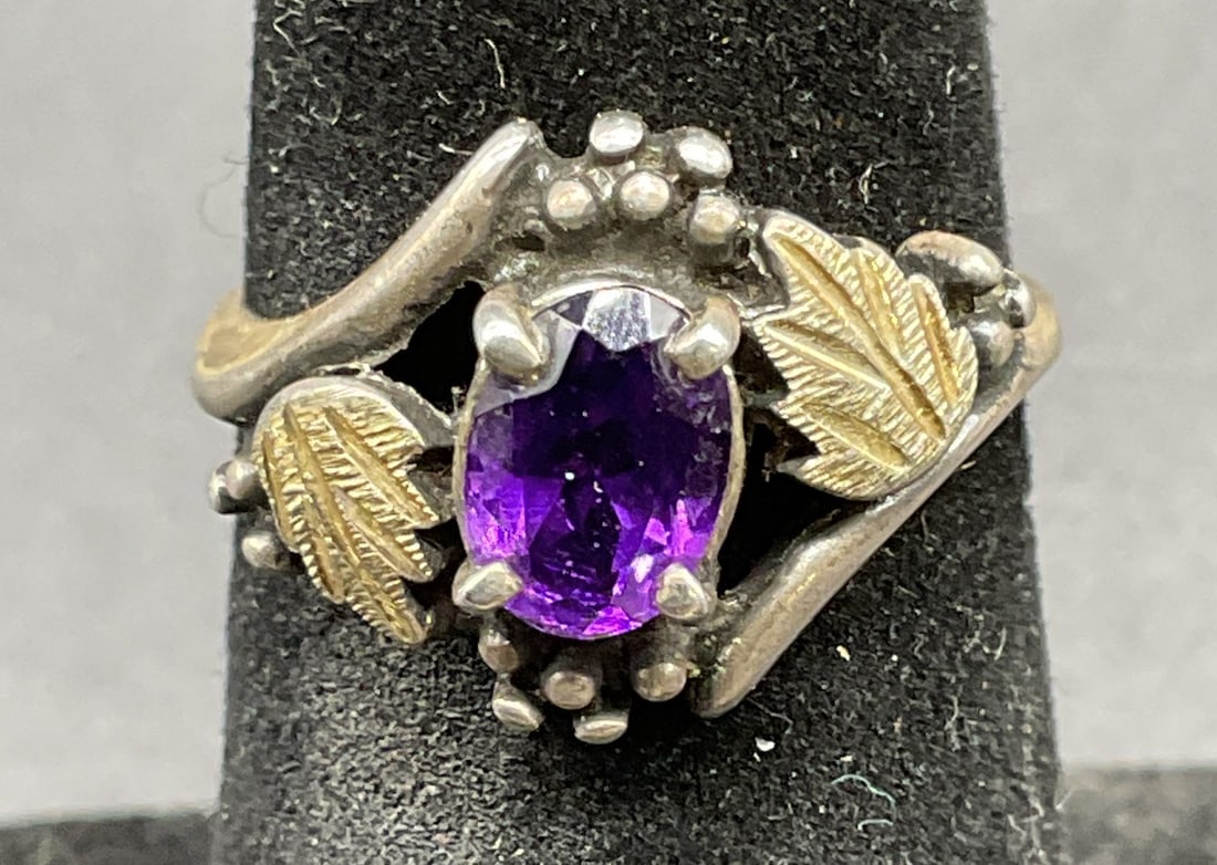 Vintage Sterling Silver Amethyst Ring: Vintage sterling silver and amethyst ring with decorative leaf setting. Size 4.5. Total weight 2.8 grams. Some scratching. Jewelry, estate jewelry, fine jewelry, cocktail jewelry, fashion jewelry, acc