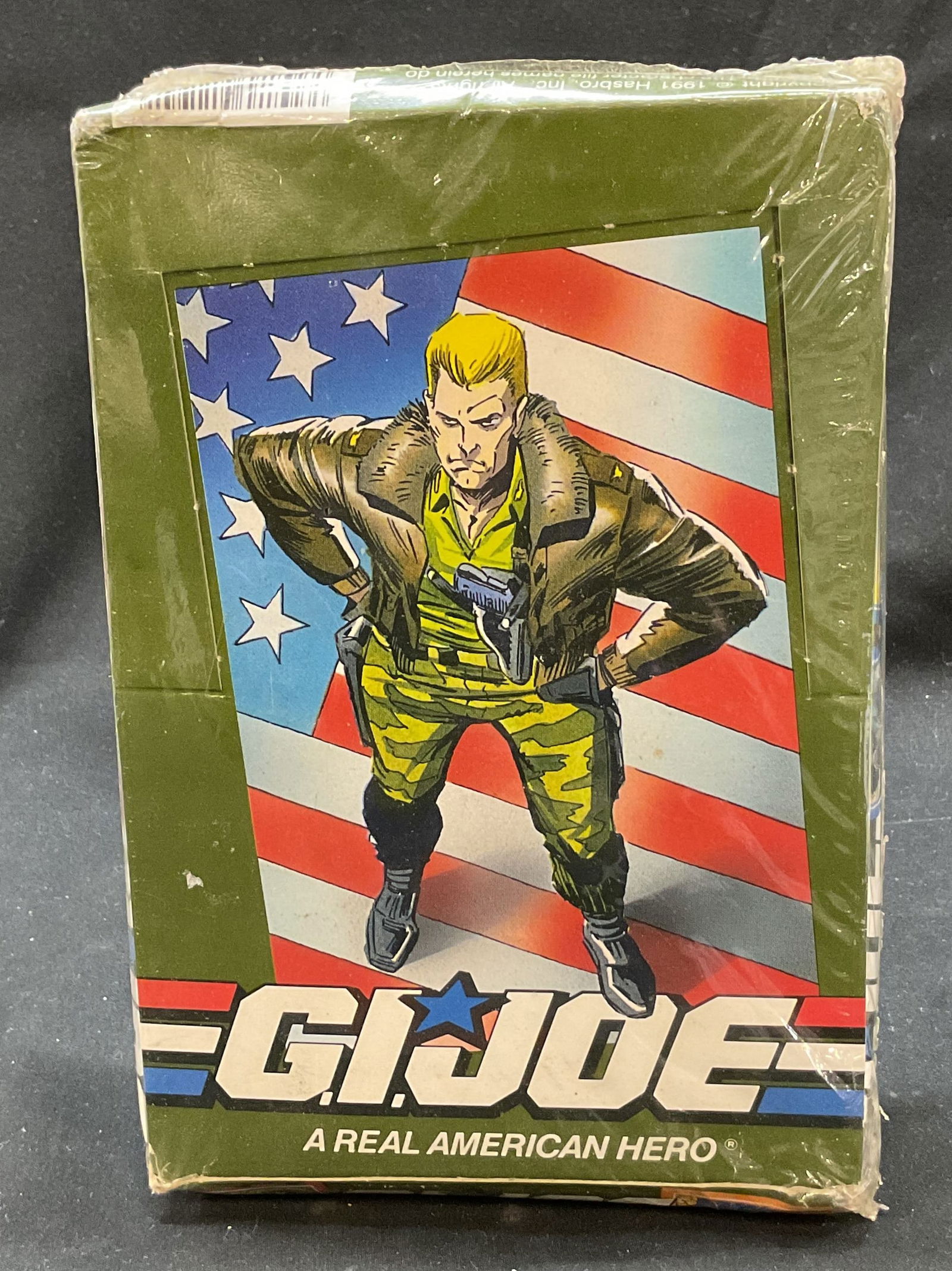 NIB G.I. Joe Trading Cards 1991 USA: New in box. G.I. Joe A Real American Hero 12 official trading cards. Made in USA. 36 packs per box. Copyright, Hasbro, 1991. Distributed by Impel Marketing Inc. Graphics on box. Measures approx 5 1/2
