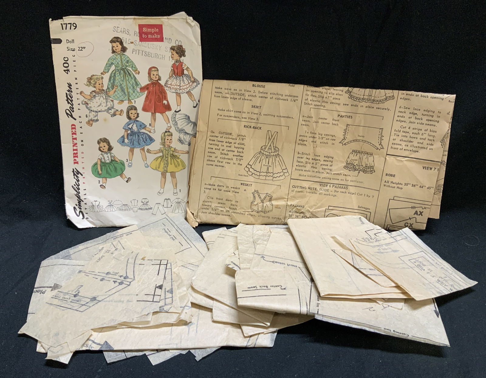 Vtg Simplicity Printed Sewing Pattern 22in: Vintage Simplicity printed sewing pattern for an 22 inch baby doll 1779. Patterns includes instructions and templates for creating various items of doll clothing, as illustrated by the drawings on the