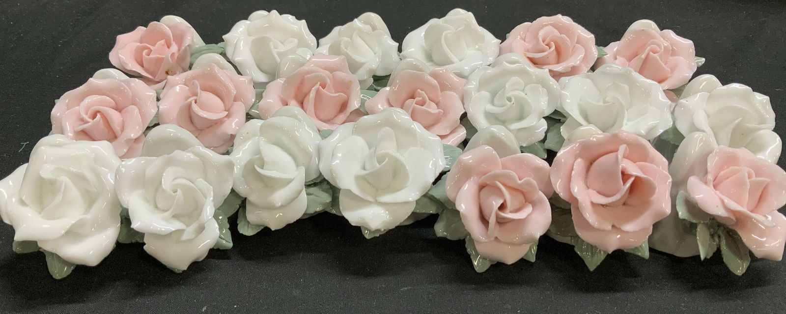 Set 20 Pink & White Porc Place Card Holders: Lot includes, set 20 porcelain place card holders. Card holders are shaped like white & pink roses. Glossy finish. Surface wear consistent to age, use & exposure. Measurements: length 2in x width 2in