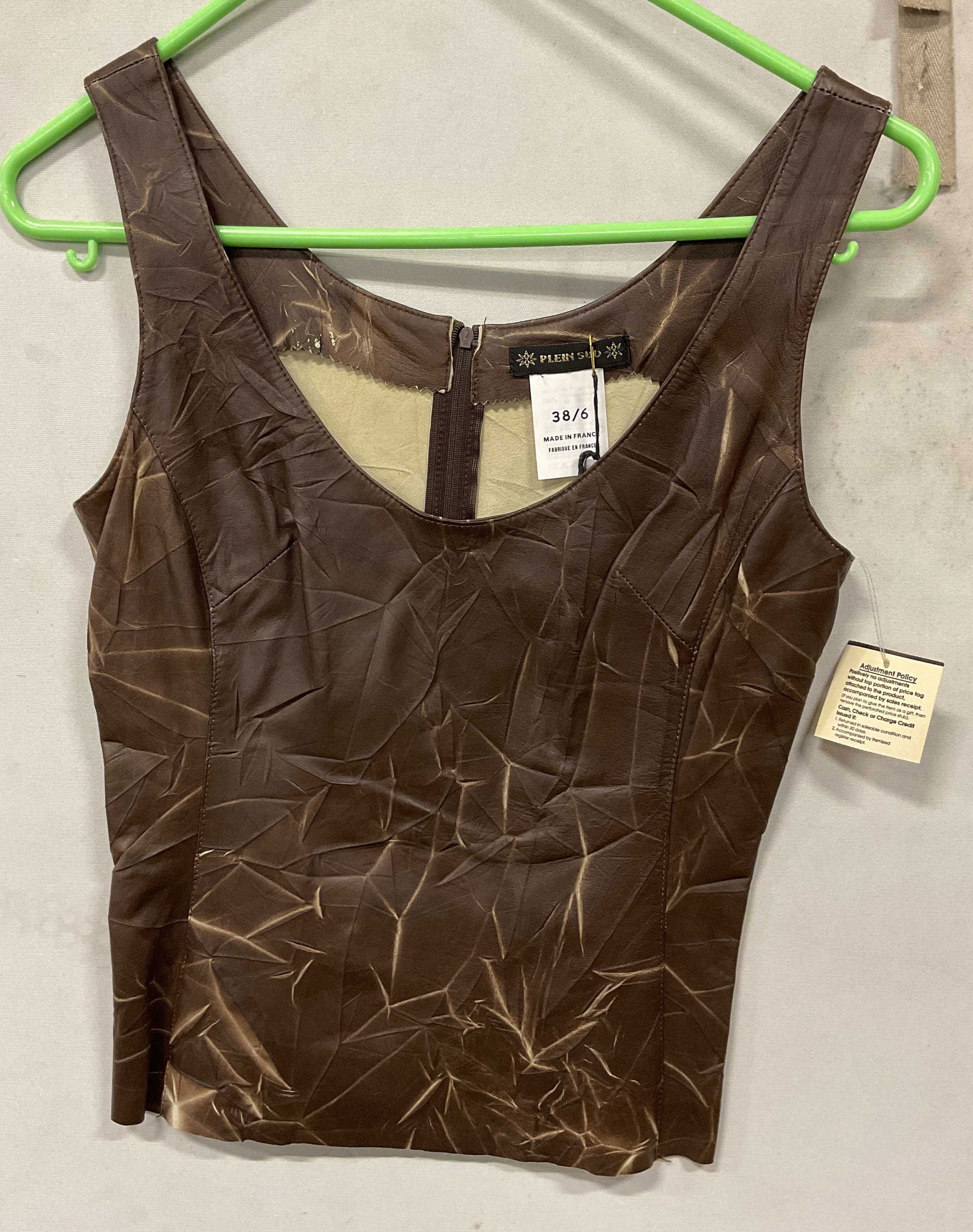 NWT Plein Sud Brown Leather Sleeveless Top France: New with tag. Plein Sud brown leather sleeveless top. Made in France. Size 6. Leather material. Zipper in back. Marbled design. Some wear to leather. Property of 1980s known Rockers Manhattan estate.