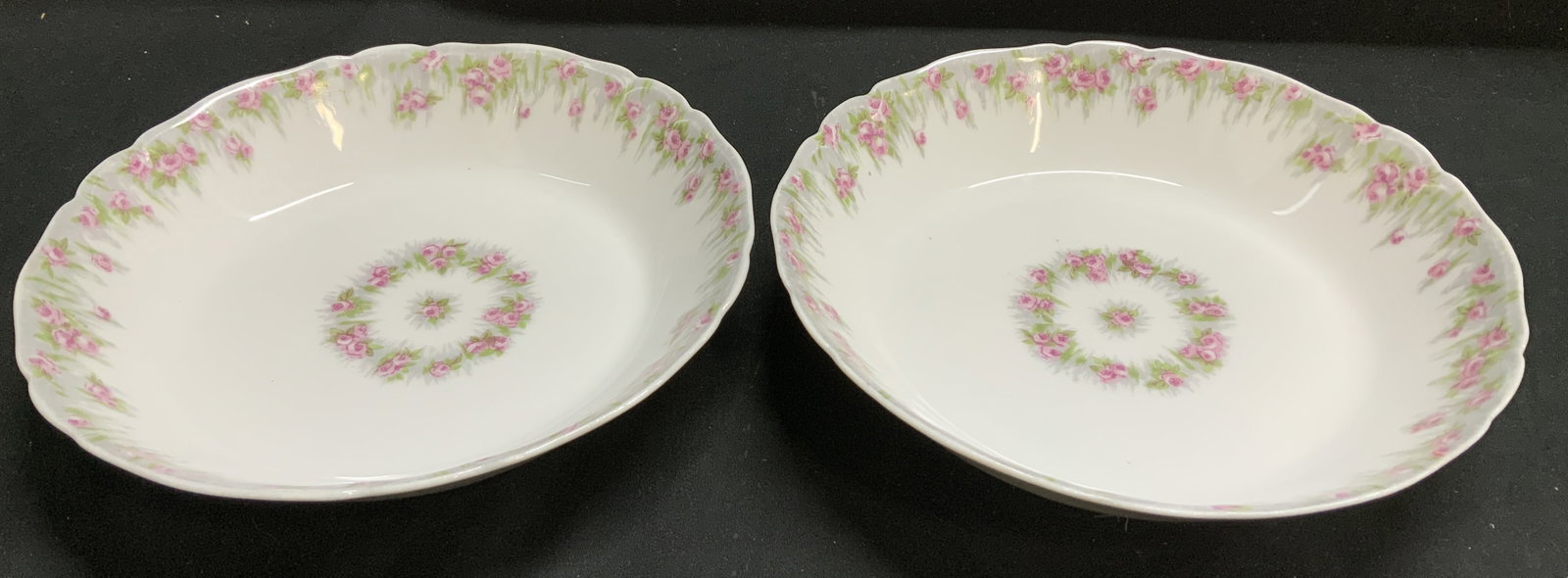 Set 2 Limoges W.G.&CO. Pink Floral Bowls FRANCE: Lot includes, 2 porcelain bowls w a pink rose garland pattern & scalloped rim. Signed & marked on underside. Reads, LIMOGES. WG & CO. FRANCE. WM GUERIN & CO. Surface wear consistent to age, use & expo