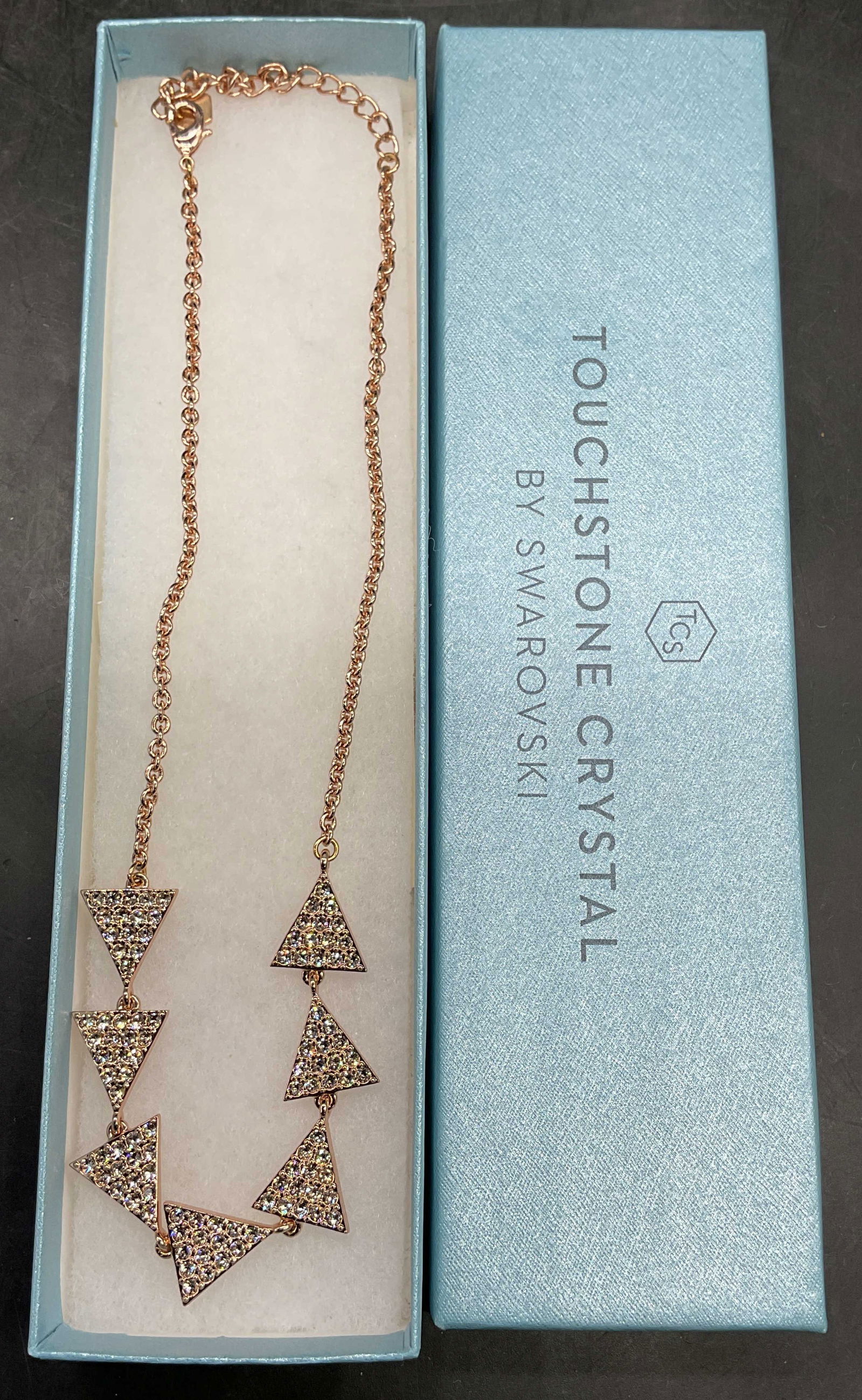 Swarovski Touchstone Gold Tn Crystal Necklace: Touchstone by Swarovski gold tone triangle crystal pendant necklace. Drop length approx 8.5 inches. Includes box. Some scratching. Jewelry, estate jewelry, costume jewelry, cocktail jewelry, fashion j