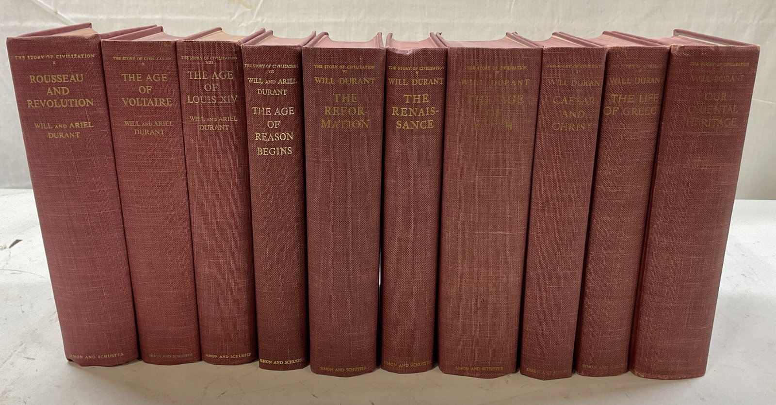 Set 10 Story Of Civilization Books 1935-60s Durant: Set of 10 books. Hard cover red books. The Story Of Civilization series by Will and Ariel Durant. Titles include Our Oriental Heritage (1935), The Life Of Greece (1939), Caesar And Christ (1944), The 