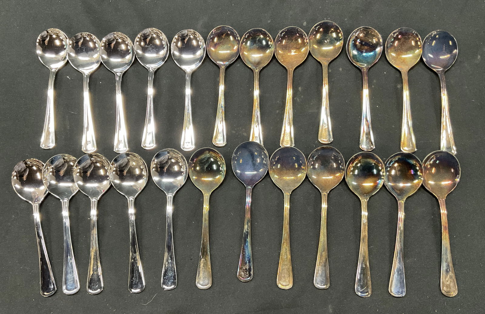 Set24 SGND Delta Airlines World Silver Plated Spoons: 24 piece set of Delta silver plated spoons. Comes in box. Signed and marked on underside, reads as follows 240 World Delta. Measures approx 6 inches long. Most have tarnishing and discoloration. Surfa
