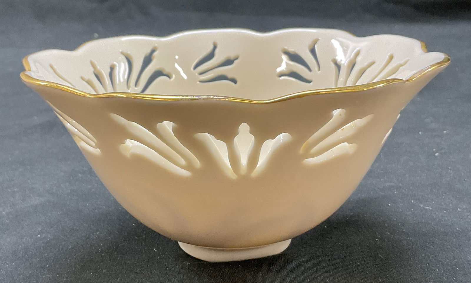 SGND Lenox Floral Porcelain Gilt Bowl USA: Signed Lenox floral porcelain gilt bowl. Made in USA. Signed and marked on underside, reads as follows Lenox Made In USA. Scalloped and gilt decorated rim. Raised and cutout floral motifs. Measures ht
