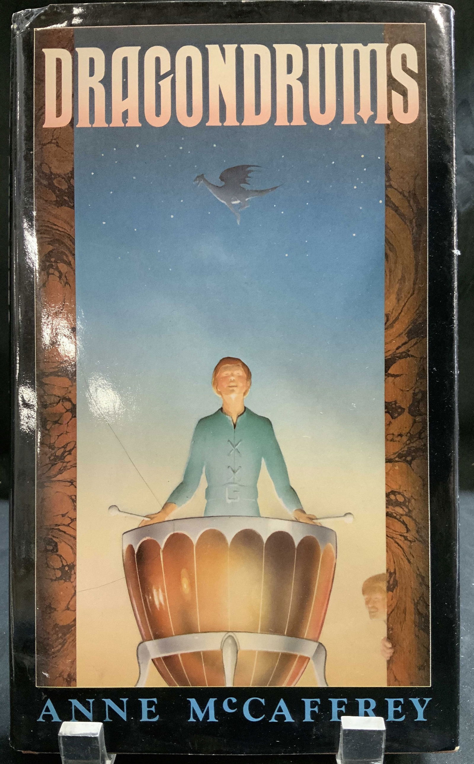 1979 Dragondrums 1st Edition Book Anna MCCAFFREY: Dragondrums by Anne McCaffrey. An Argo Book. Copyright 1979. First Edition. Front cover features illustrations of a man standing behind a drum. Surface wear consistent to age, use & exposure. Measurem