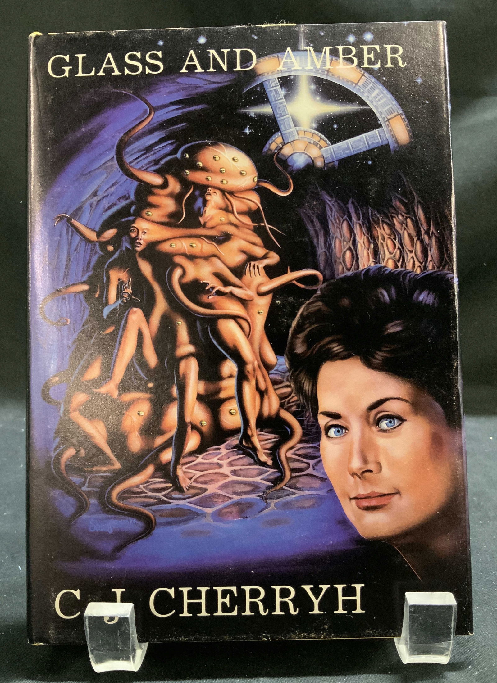 1987 Glass & Amber 1st Limit Ed Bk CJ CHERRYH: Glass & Amber. By C.J. Cherryh. Copyright 1987. First Edition. Limited numbered edition of 1000. Number 864. The NESFA Press. Front cover features illustrations of a woman & mythical creatures. Surfac