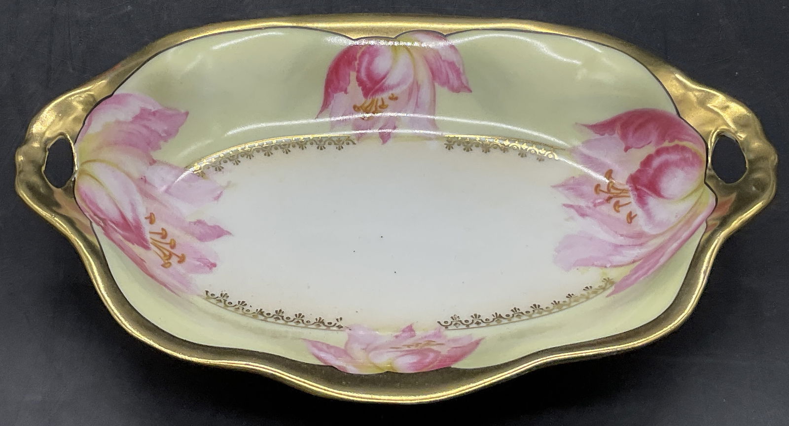 PRUSSIA Vintage Floral Porcelain Trinket Dish: PRUSSIA Vintage Floral Porcelain Trinket Dish / Keepsake Dish. Hand painted details to the piece. Pink florals alongside gilt line work. Underside is trademarked and reads PRUSSIA. Gilt numbers to the