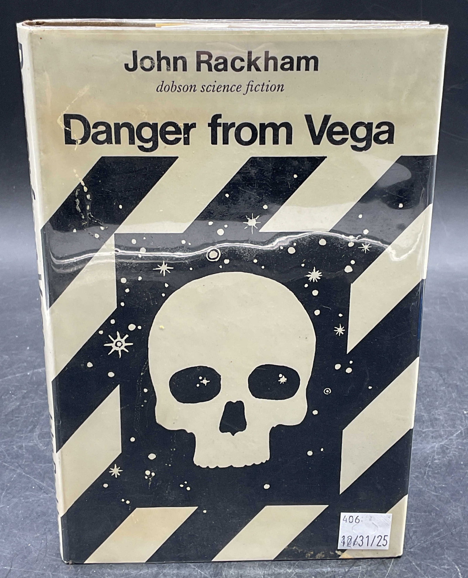 John Rackham Danger From Vega 1970: Hardcover copy of Danger From Vega by John Rackham. First British edition. Published by Dobson, 1970. Measures approx 8 x 5.25 inches. Some wear to cover, pages, and binding consistent with exposure. 