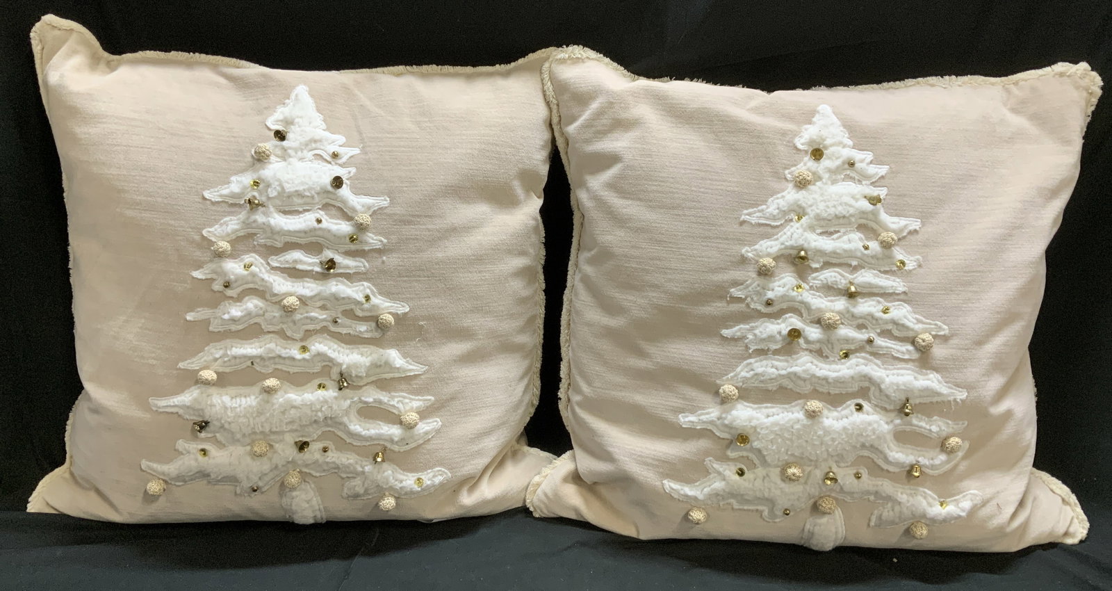 Pair Pottery Barn Christmas Tree Throw Pillows: Lot includes, pair of Pottery Barn Christmas tree motifs throw pillows. Christmas tree features bell & pom-pom accents. Cotton & polyester material. Surface wear consistent to age, use & exposure. Mea