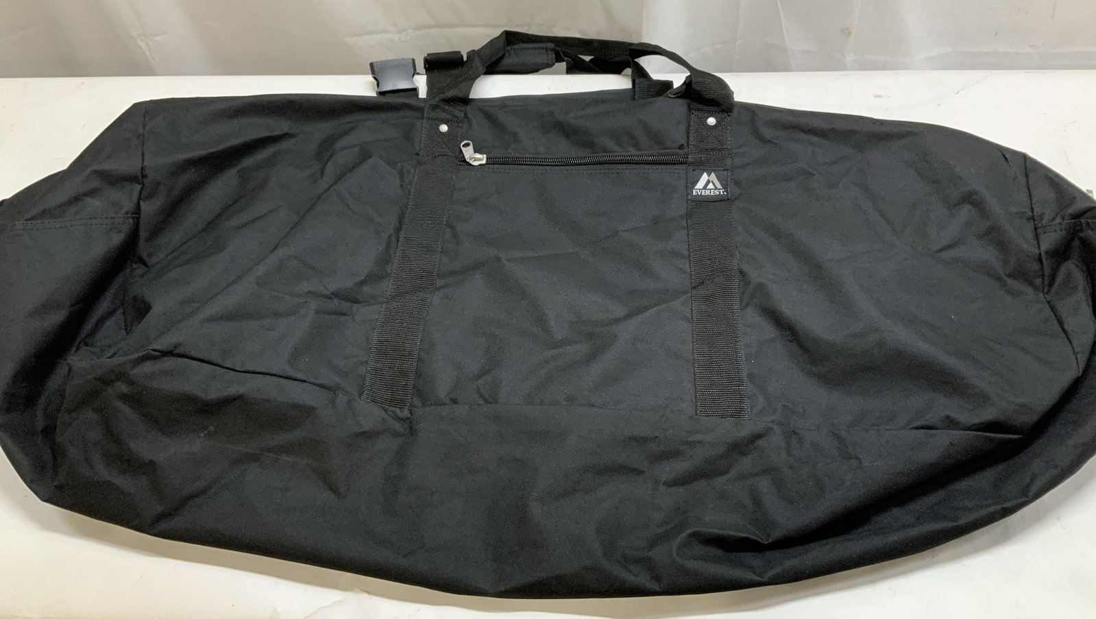 Everest X Large Gear Black Duffle Bag 48in: Everest X Large gear black duffel back. Comes with double handles & buckle. Zipper pocket compartment. Signed & marked. Reads, EVEREST. Surface wear consistent to age, use & exposure. Measurements: le