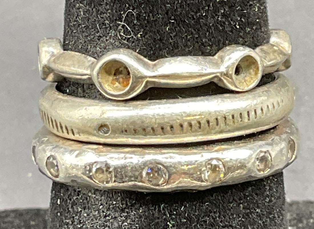 Lot 3 Vintage Sterling Silver & Crystal Rings: Lot of 3 vintage sterling silver rings. One with colorless crystals. Largest ring size 7. Total weight of all rings 6.6 grams. Marked or tested for sterling using acid test. Some scratching. Jewelry,