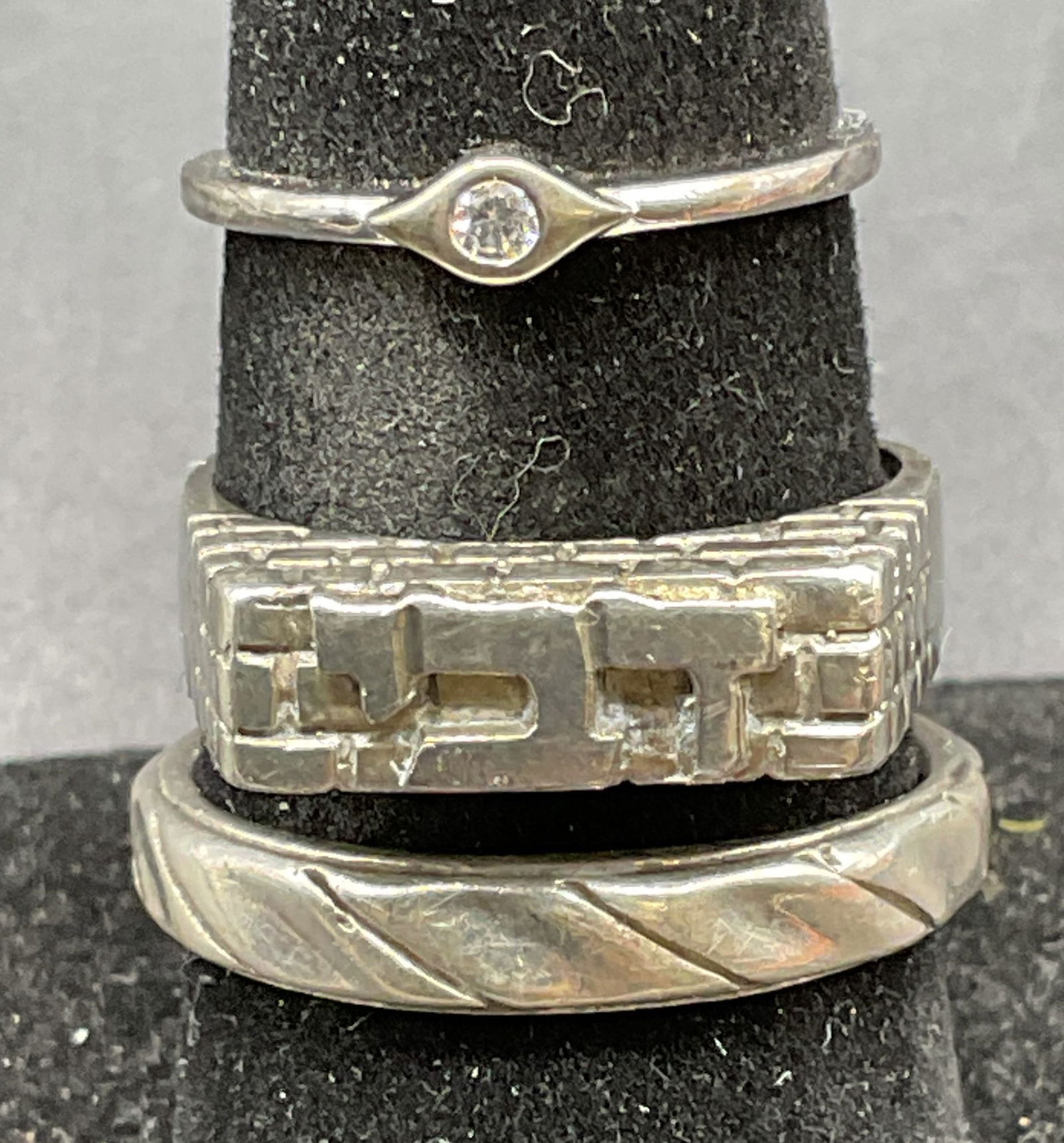 Lot 3 Vintage Sterling Silver Rings: Lot of 3 vintage sterling silver rings. Swirl band, lettering band, and crystal setting. Largest ring size 8.5. Total weight of all rings 8.2 grams. Some scratching. Jewelry, estate jewelry, fine jewe