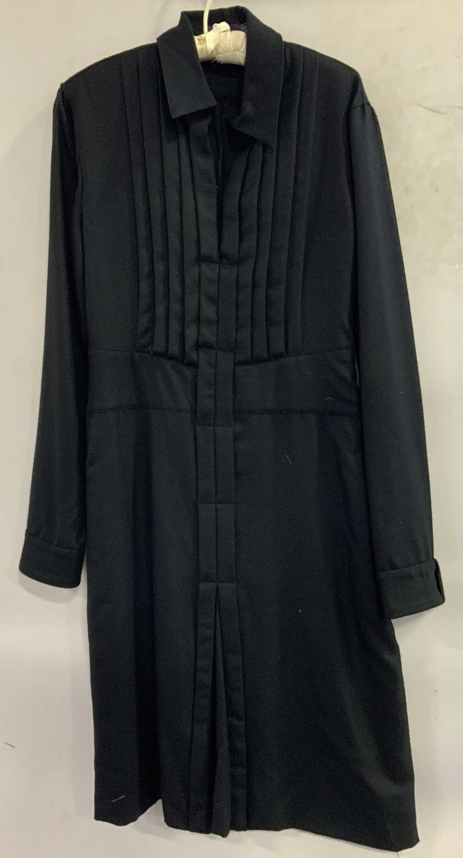 Asprey London Black Wool Long Dress USA: Black long sleeve dress with pointed collar & pleated bib style front panel. Front closure. Appears to be wool, possible synthetic. Signed & marked. Reads, ASPREY LONDON. USA 10. Surface wear consiste